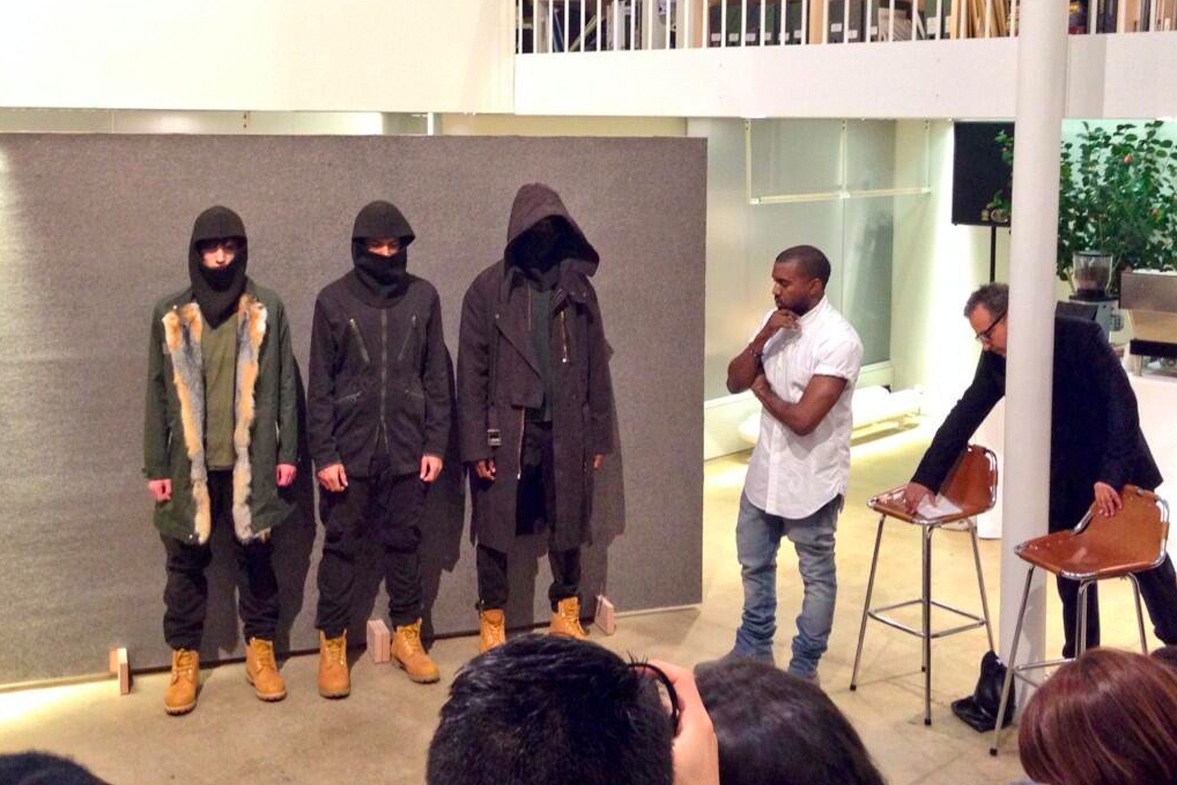 Kanye West explaining his concepts and presenting pieces from his second A.P.C. collaboration collection for Fall/Winter 2014