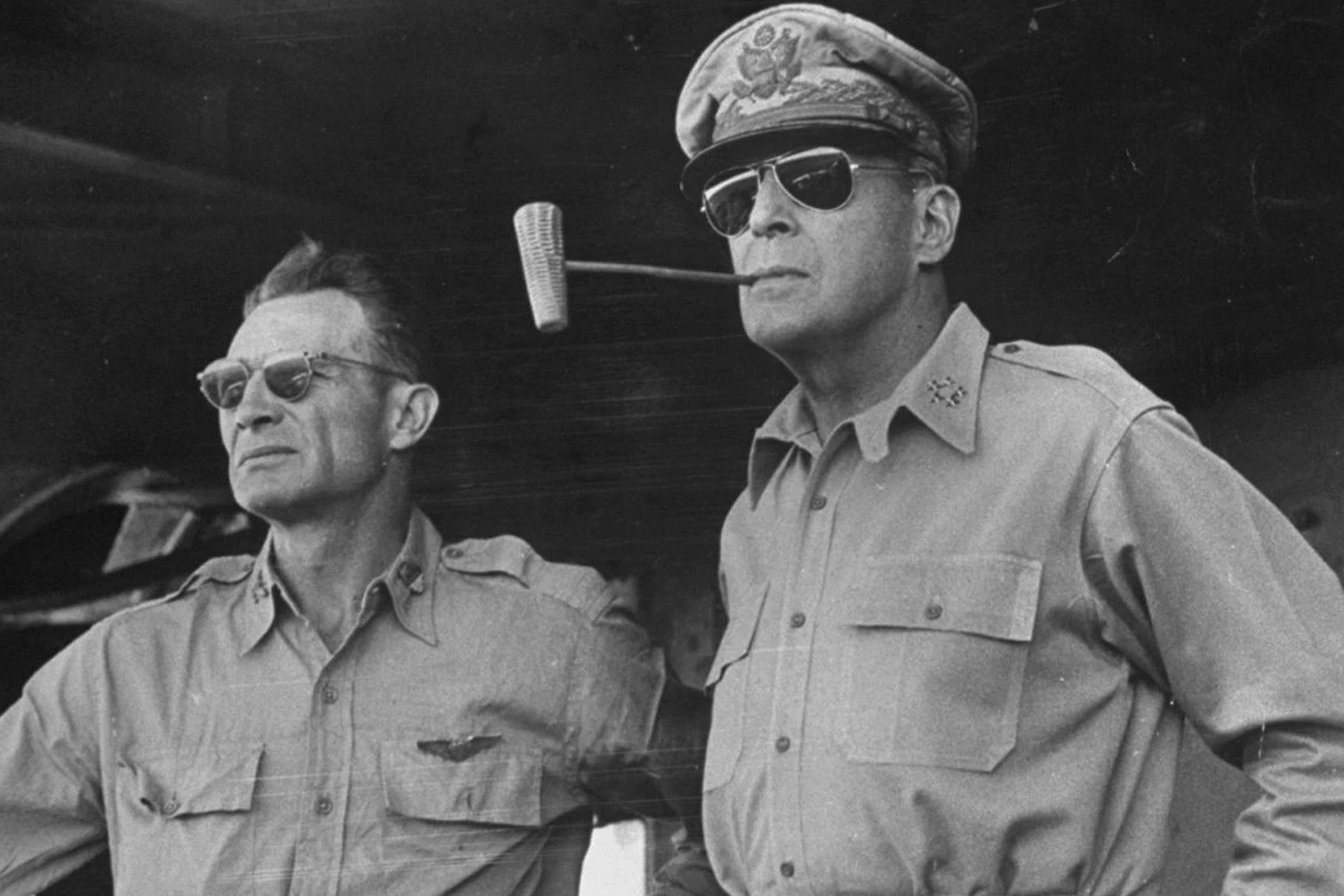 General Douglas MacArthur (right) in aviator sunglasses