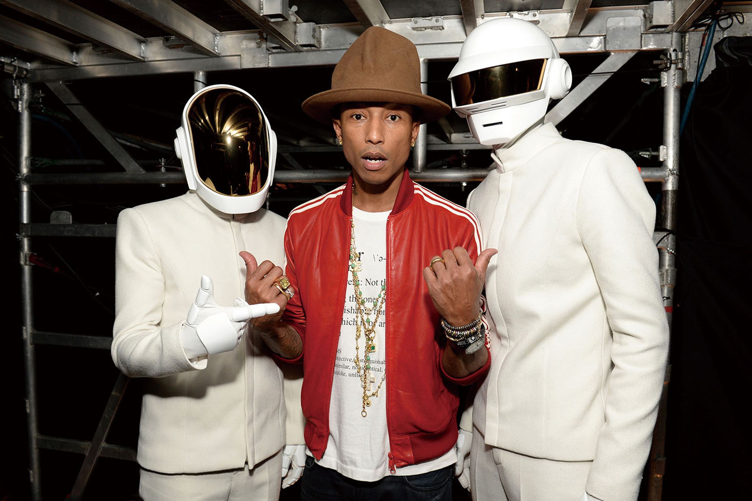 Pharrell backstage with Daft Punk (and his now-infamous Vivenne Westwood hat) at the 2014 Grammy Awards