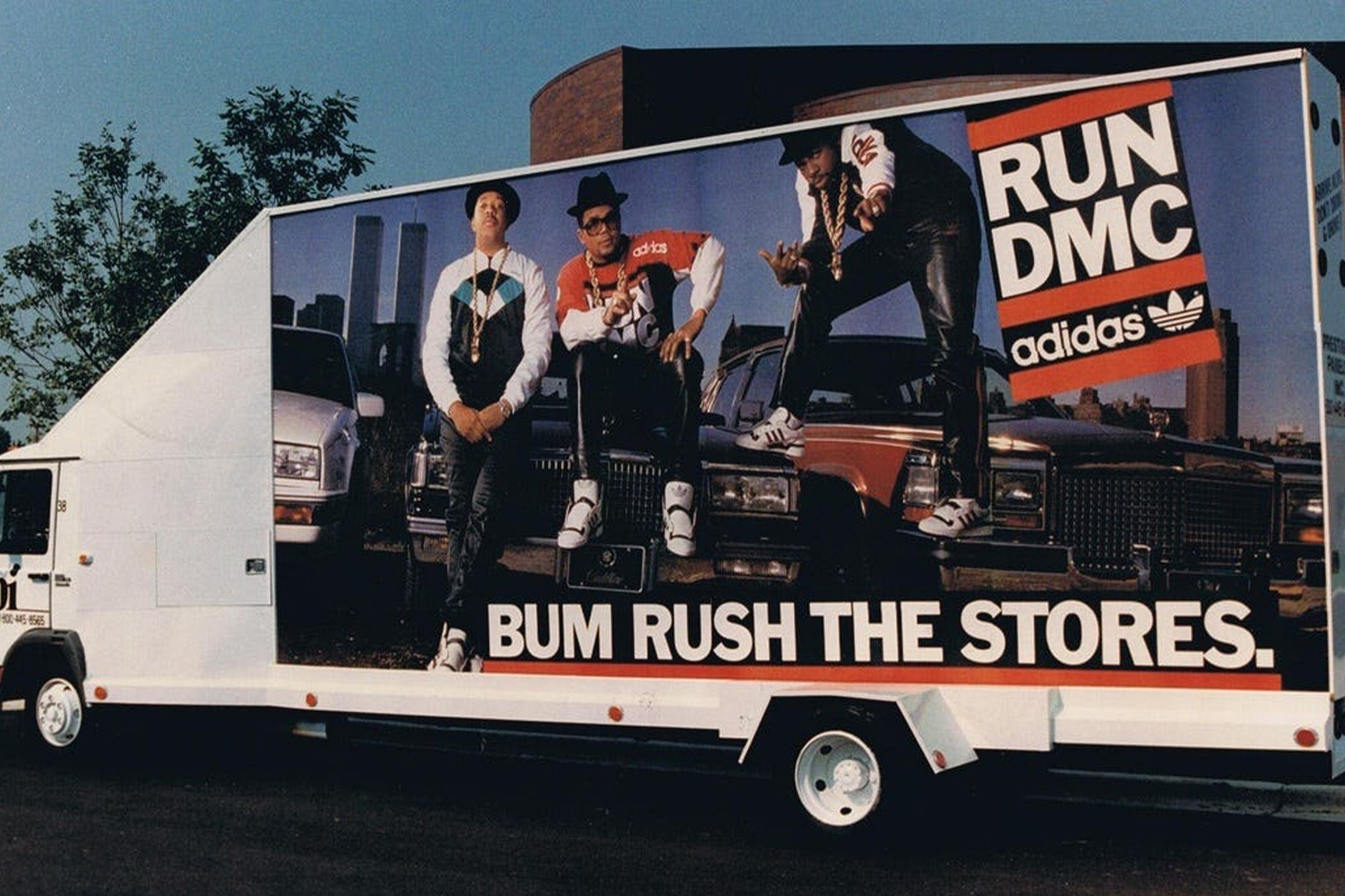 A Run-DMC adidas ad on the side of a truck