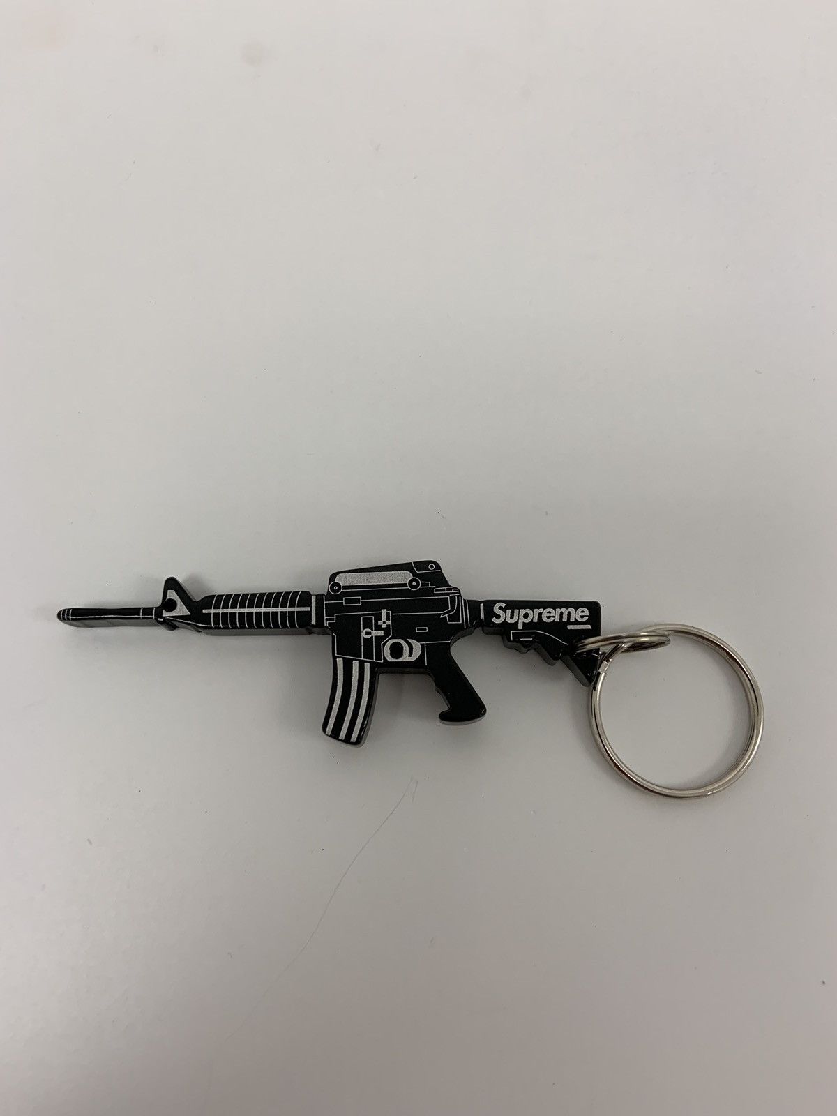 Black Supreme M16 bottle opener keychain Grailed