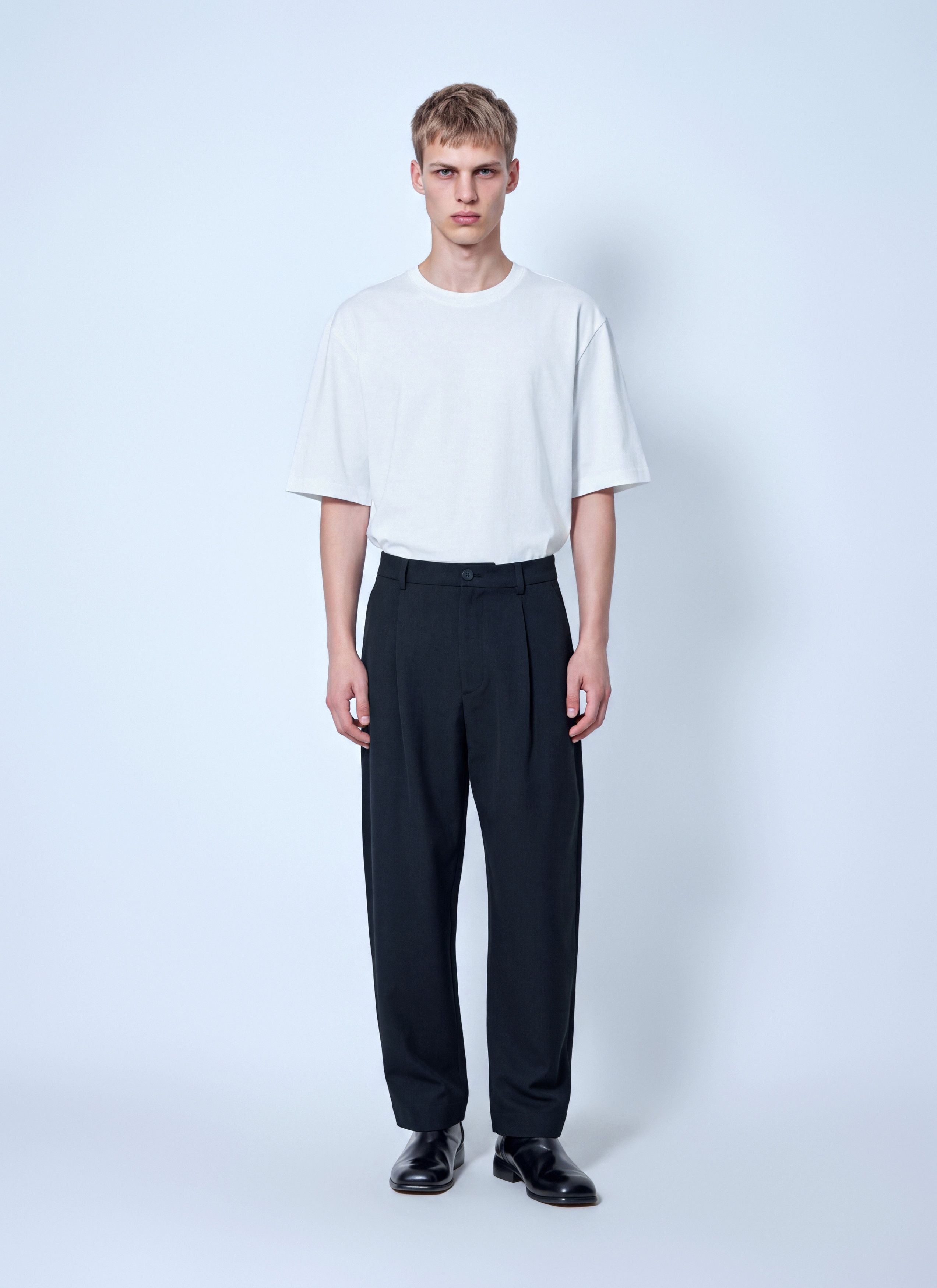 Studio Nicholson Tuck Cotton Tapered Leg Trousers in Black, Men's (Size 34) — image 2 of 6