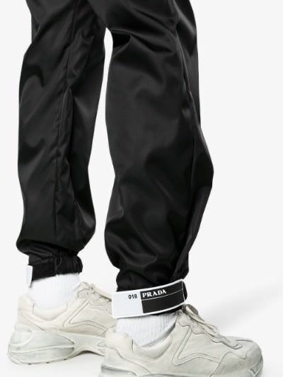 Prada rubber tag track pants on sale