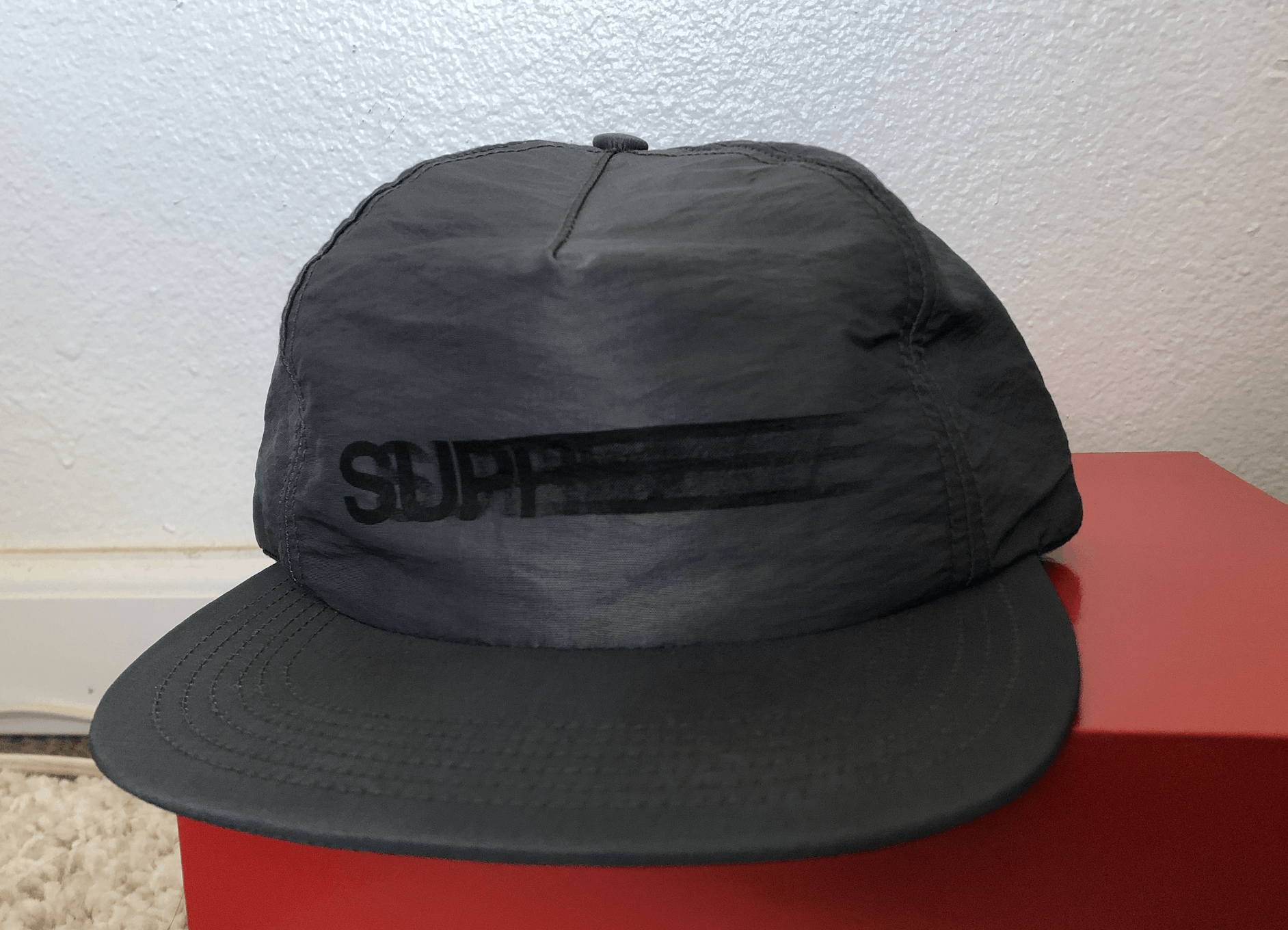 Supreme motion cheap logo cap