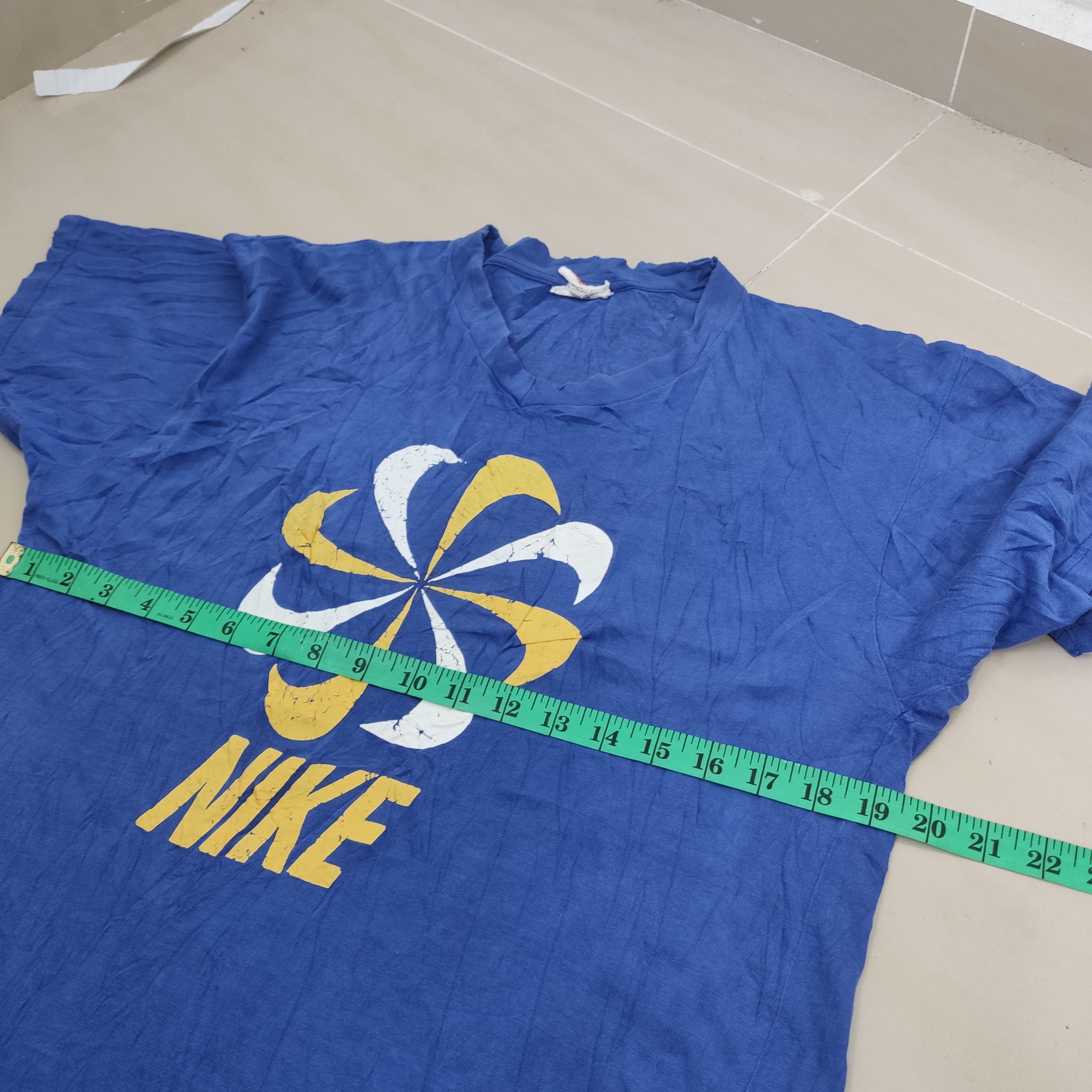 Nike pinwheel shirt shop