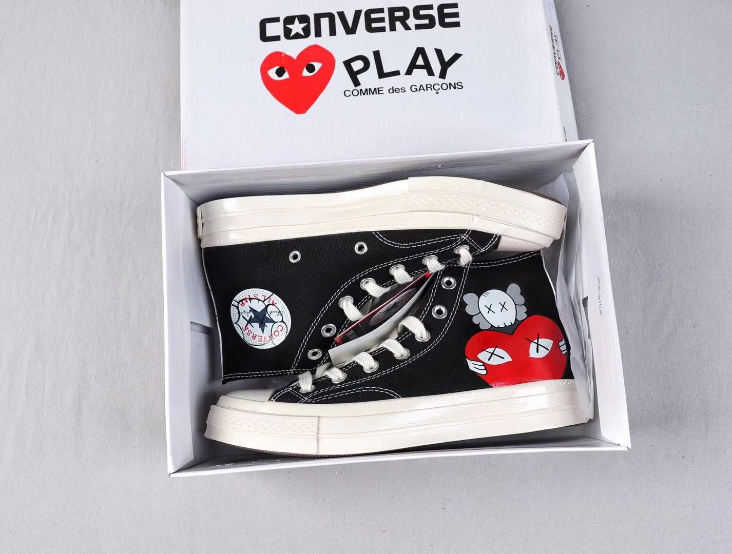 Converse x kaws price best sale