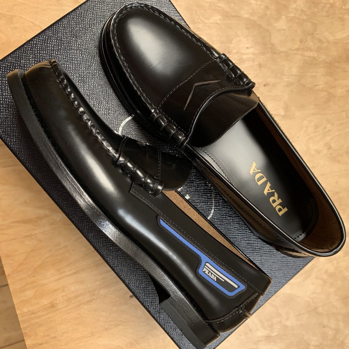 Prada Prada Logo Appliqued Spazzolato Leather Penny Loafer Grailed