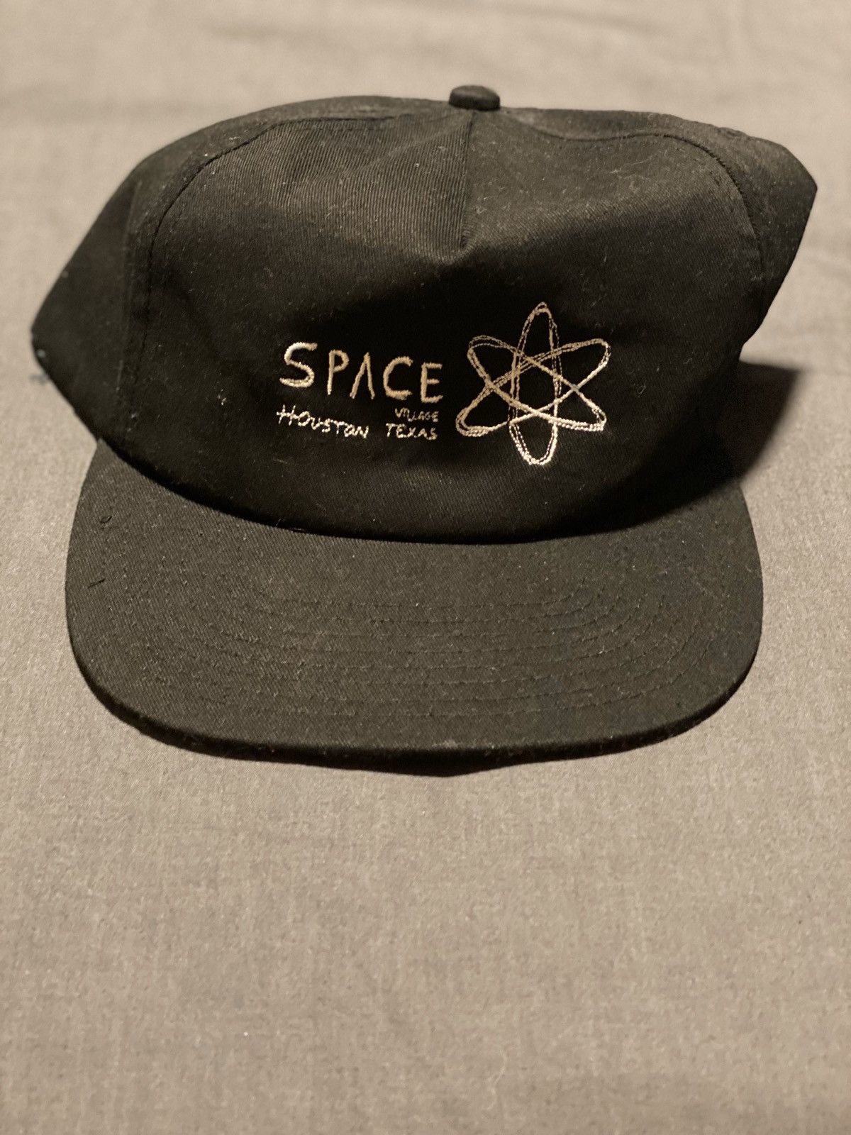 Travis Scott wearing Space Village Logo Cap, Raf Simons Virginia