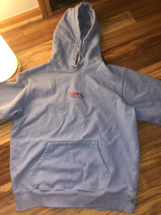 Supreme tag logo hooded hot sale sweatshirt