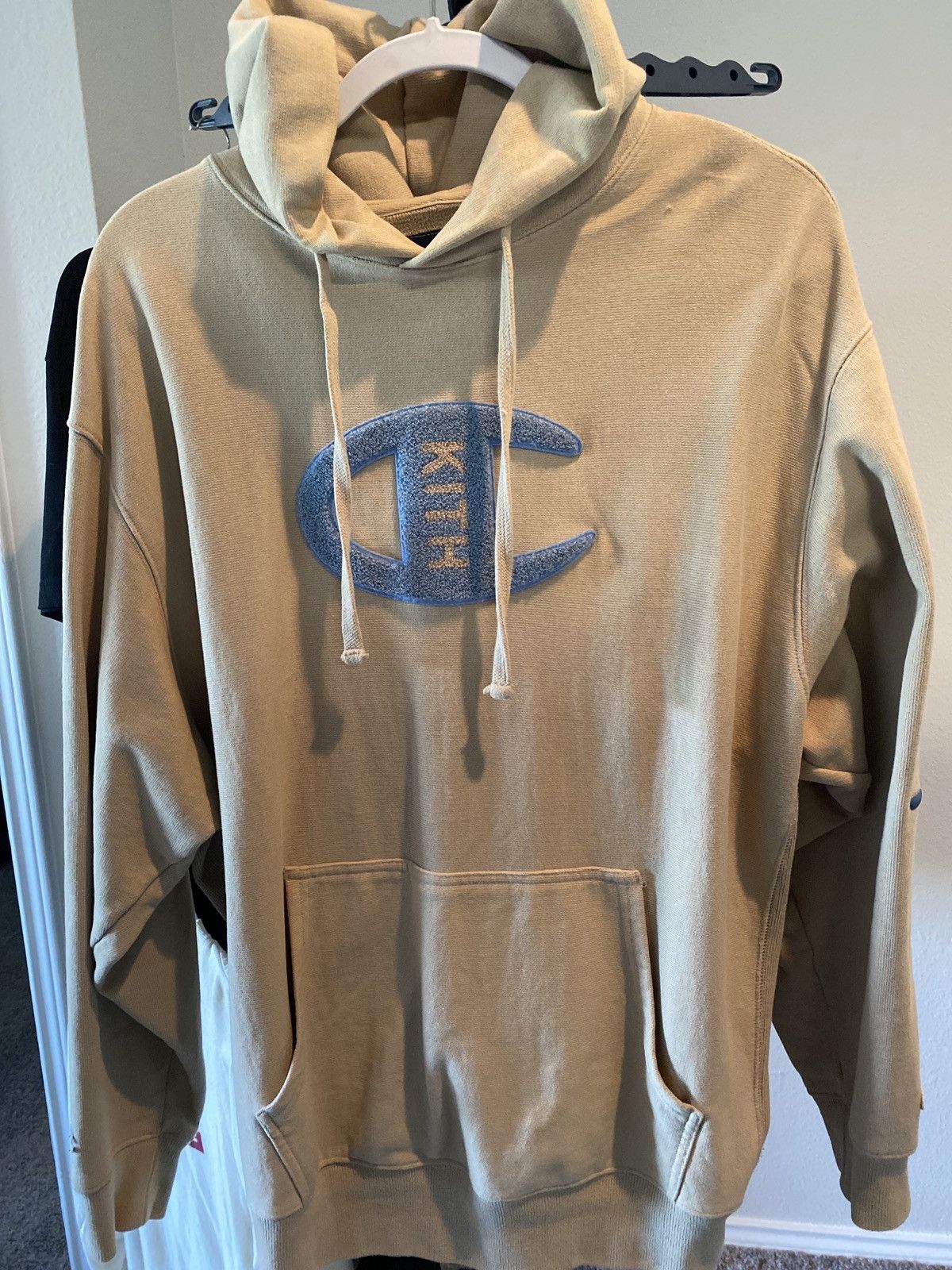 Kith champion logo hoodie hotsell