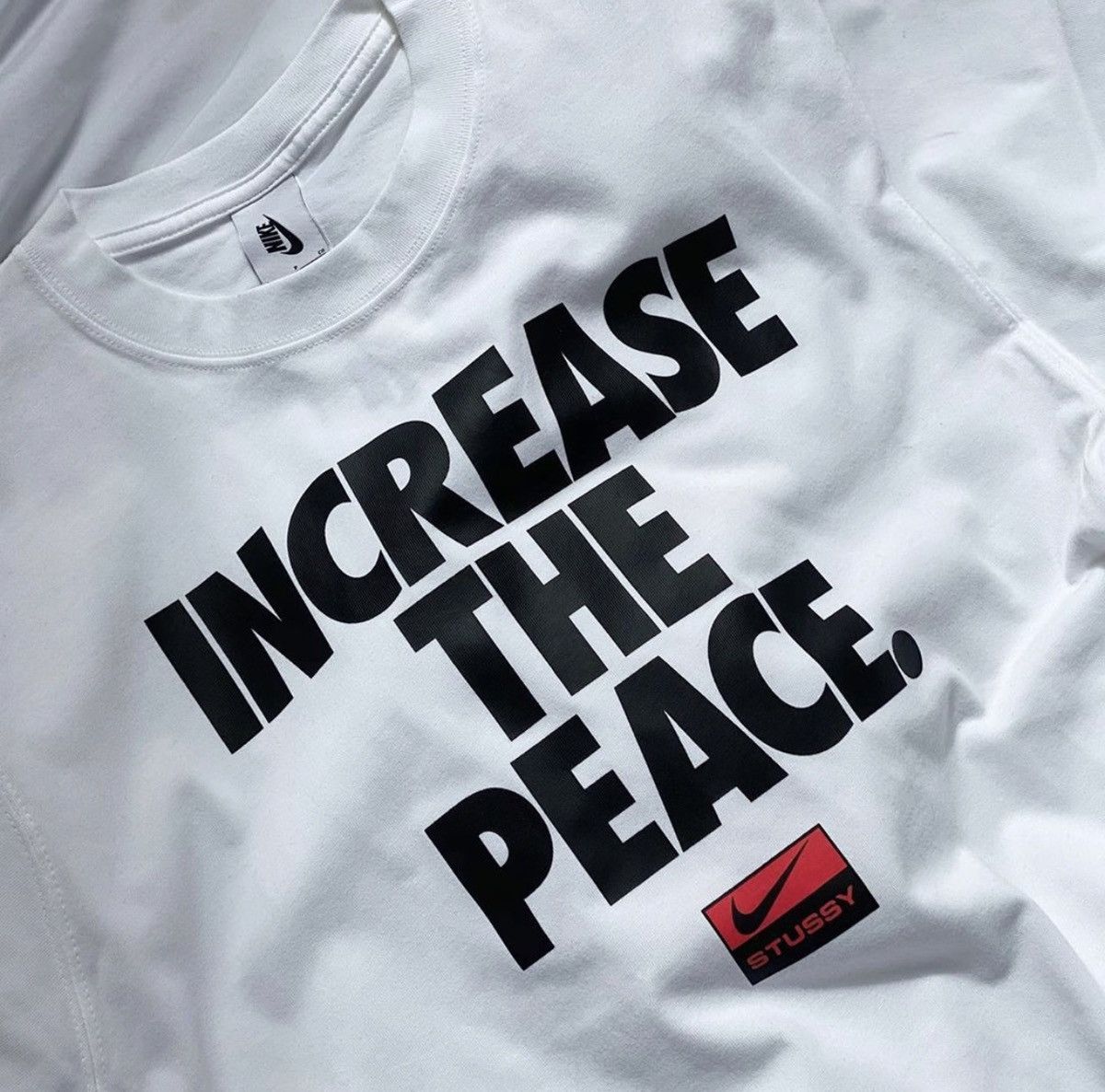 increase the peace stussy nike