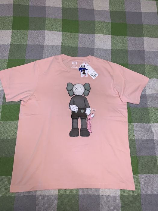 Pink best sale kaws shirt