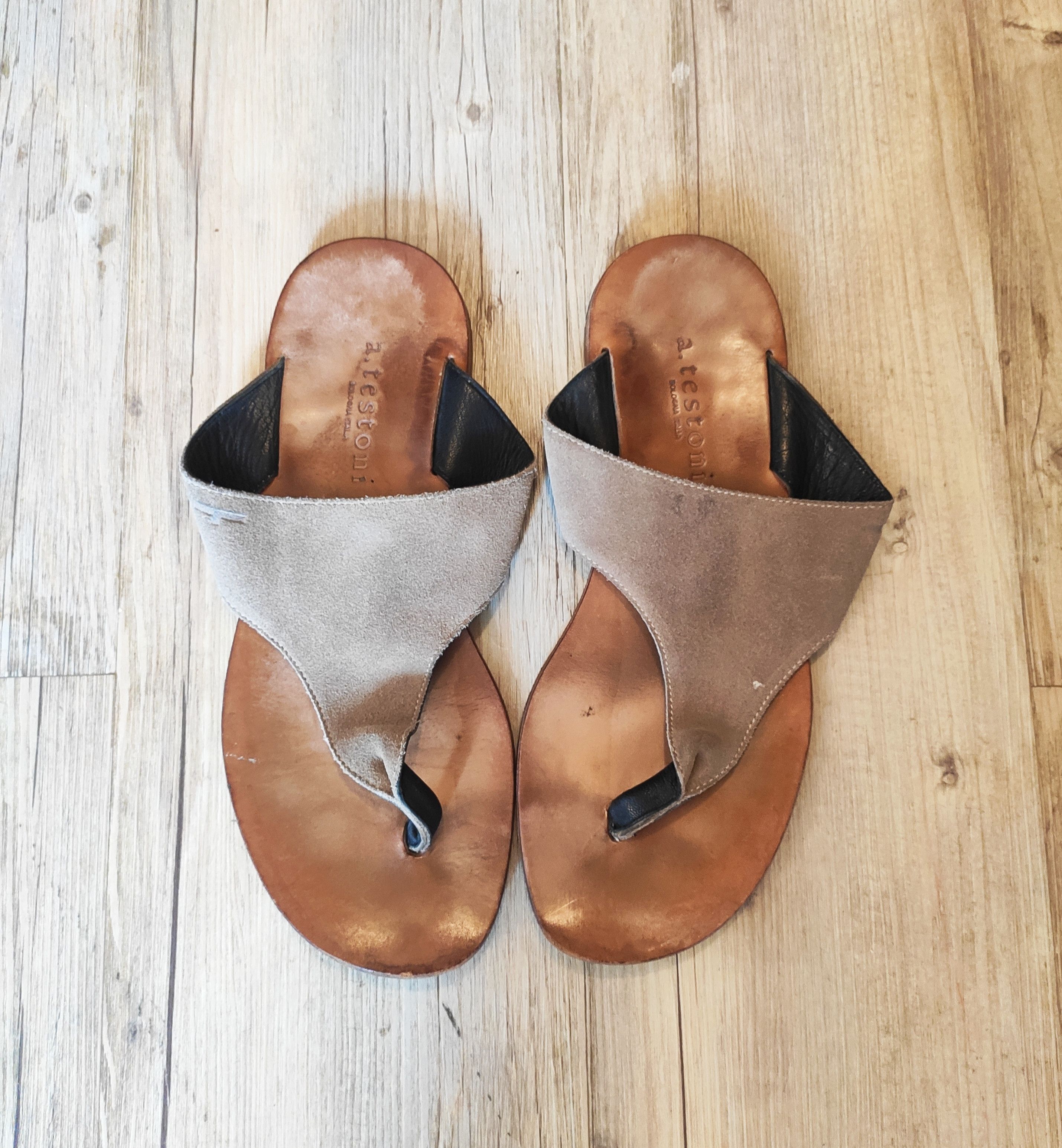 Leather flip-flops.Like Dries van Noten or Hermes