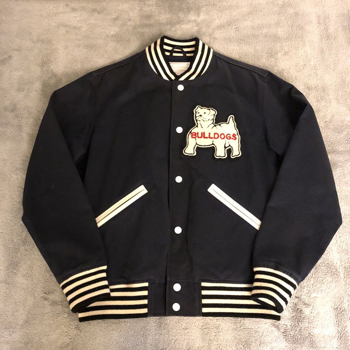 Supreme bulldog varsity on sale jacket