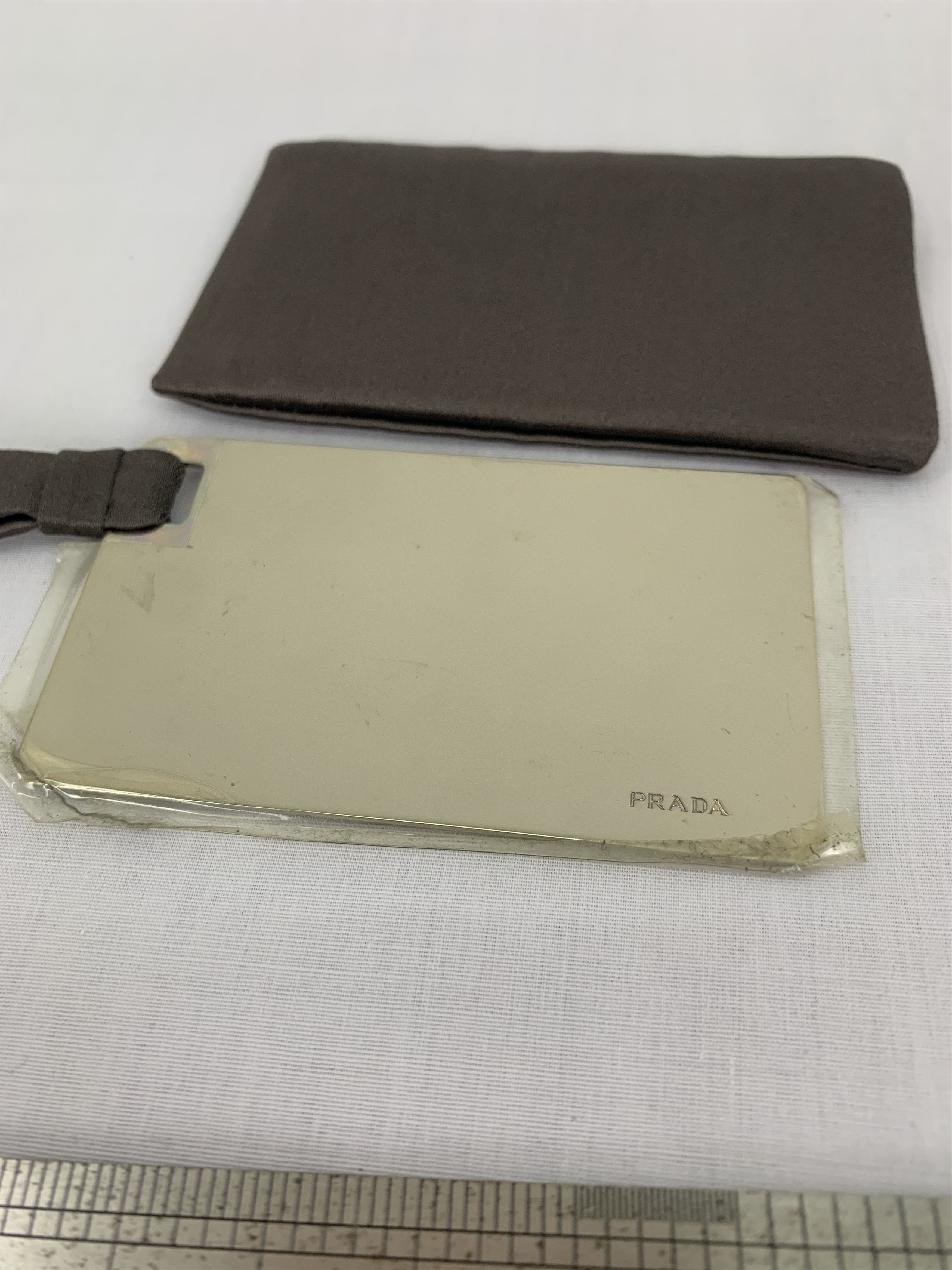 Prada Prada plate with bag keychain authentic accessories Size ONE SIZE - 1 Thumbnail