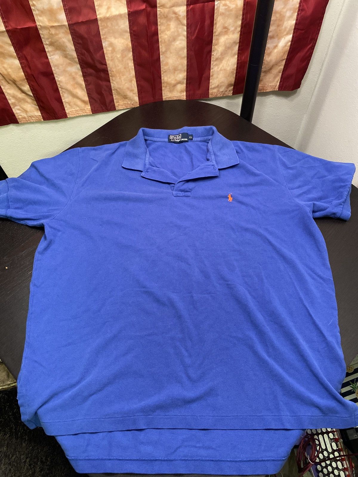 Blue polo shirt with orange horse online