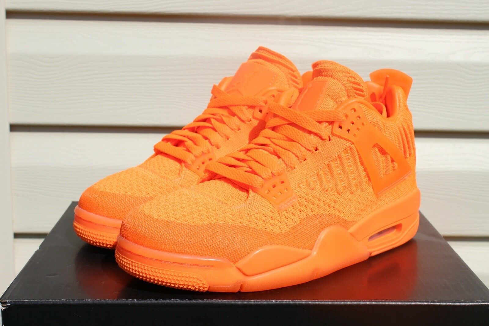 Air jordan 4 hot sale flyknit orange