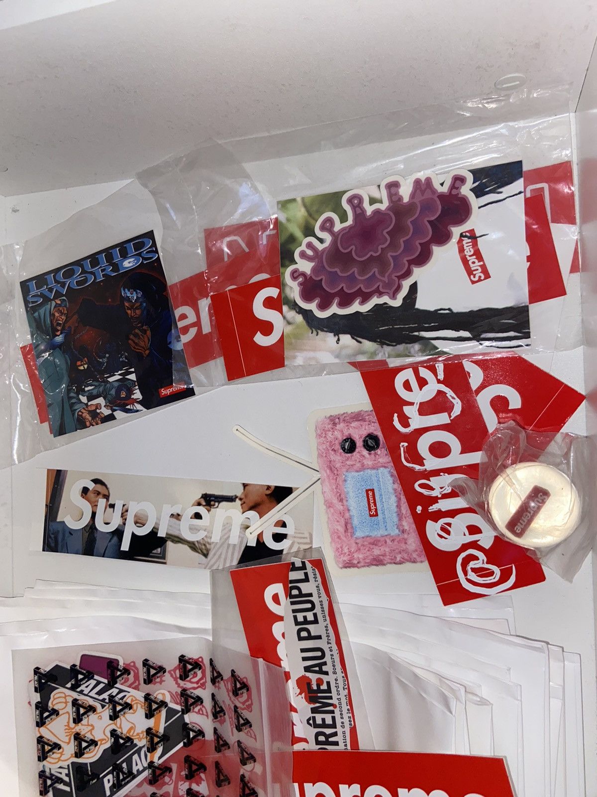 Supreme orders and palace stickers and bags