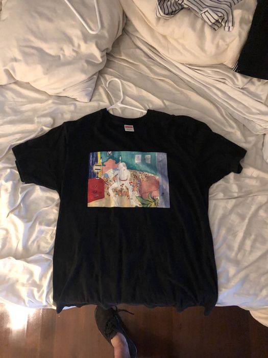 Supreme Girl sitting on bed supreme tee | Grailed