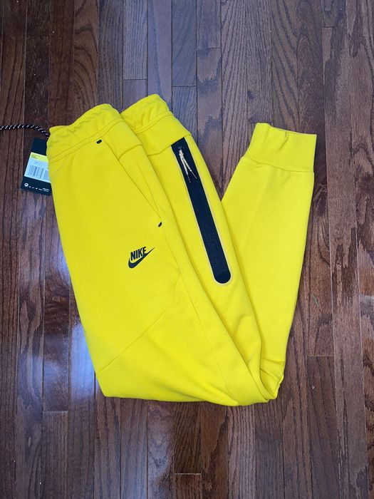 Yellow nike tech pants hot sale