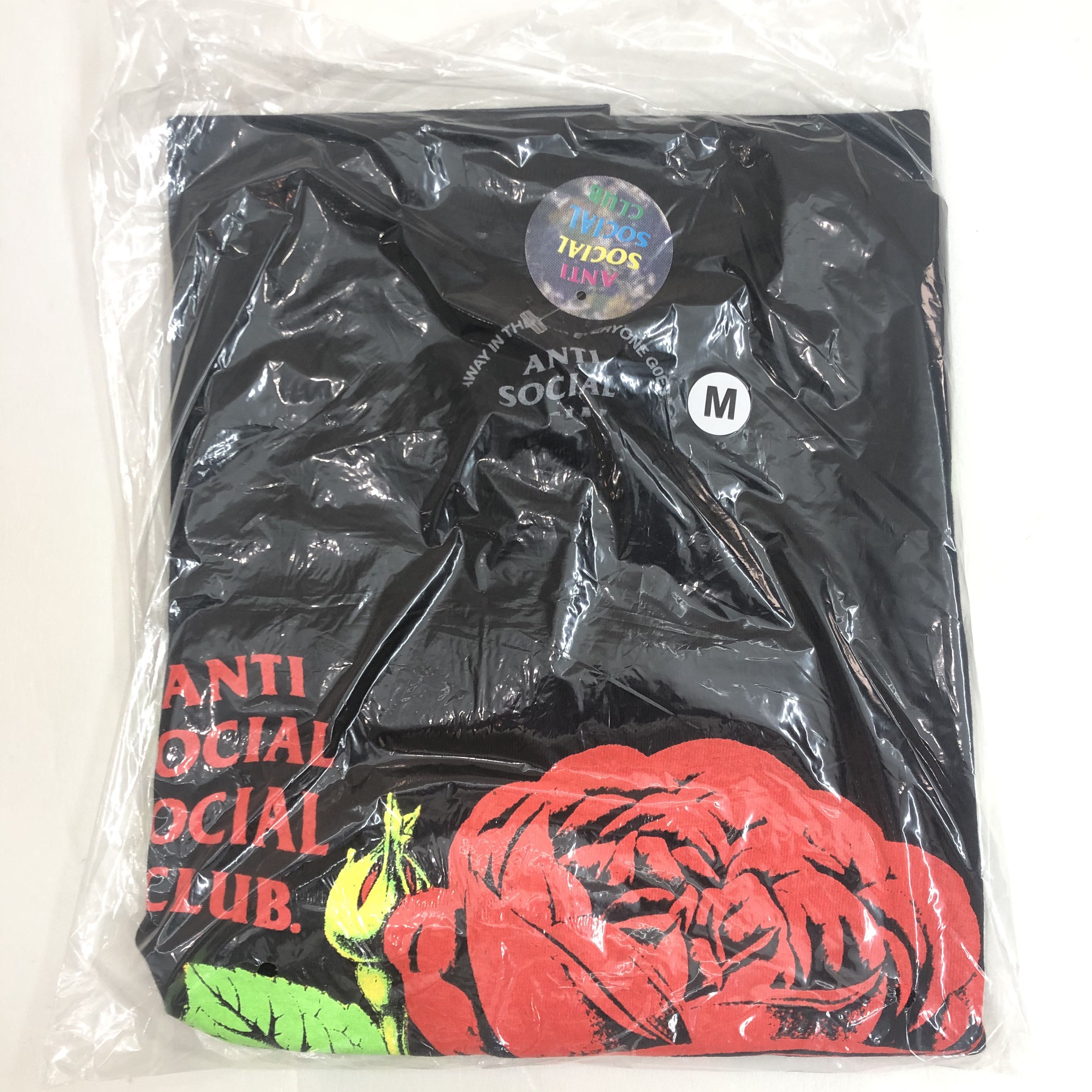 DS Green ASSC Red Rose Logo California Black Tee in hand