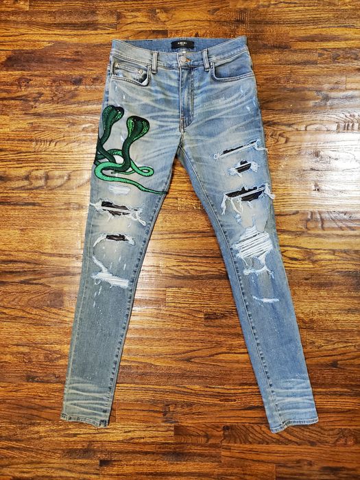 Amiri jeans store with green snake