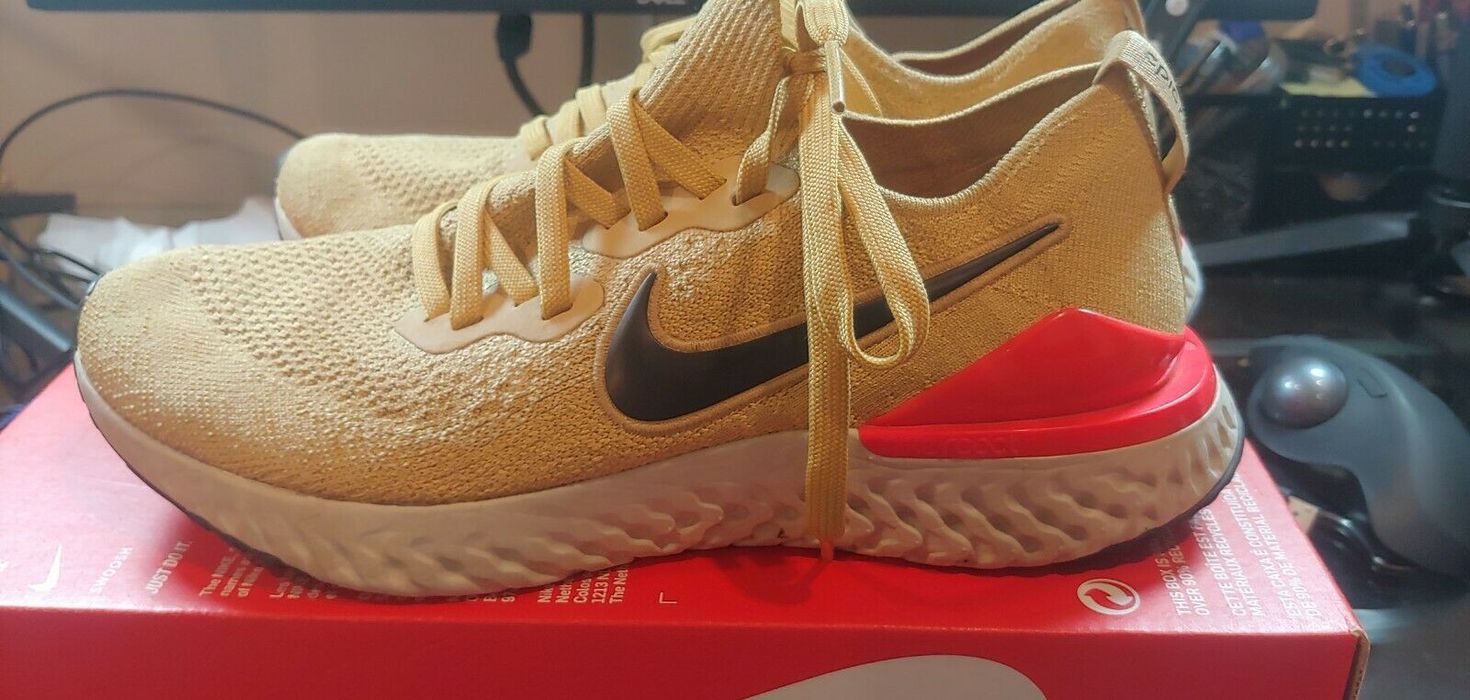 Nike epic react club gold sales