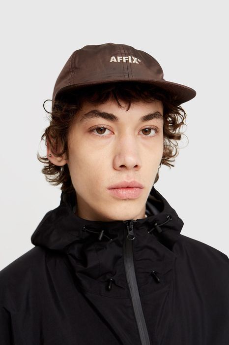 Kiko Kostadinov Affix Works brown 30 WT cap | Grailed