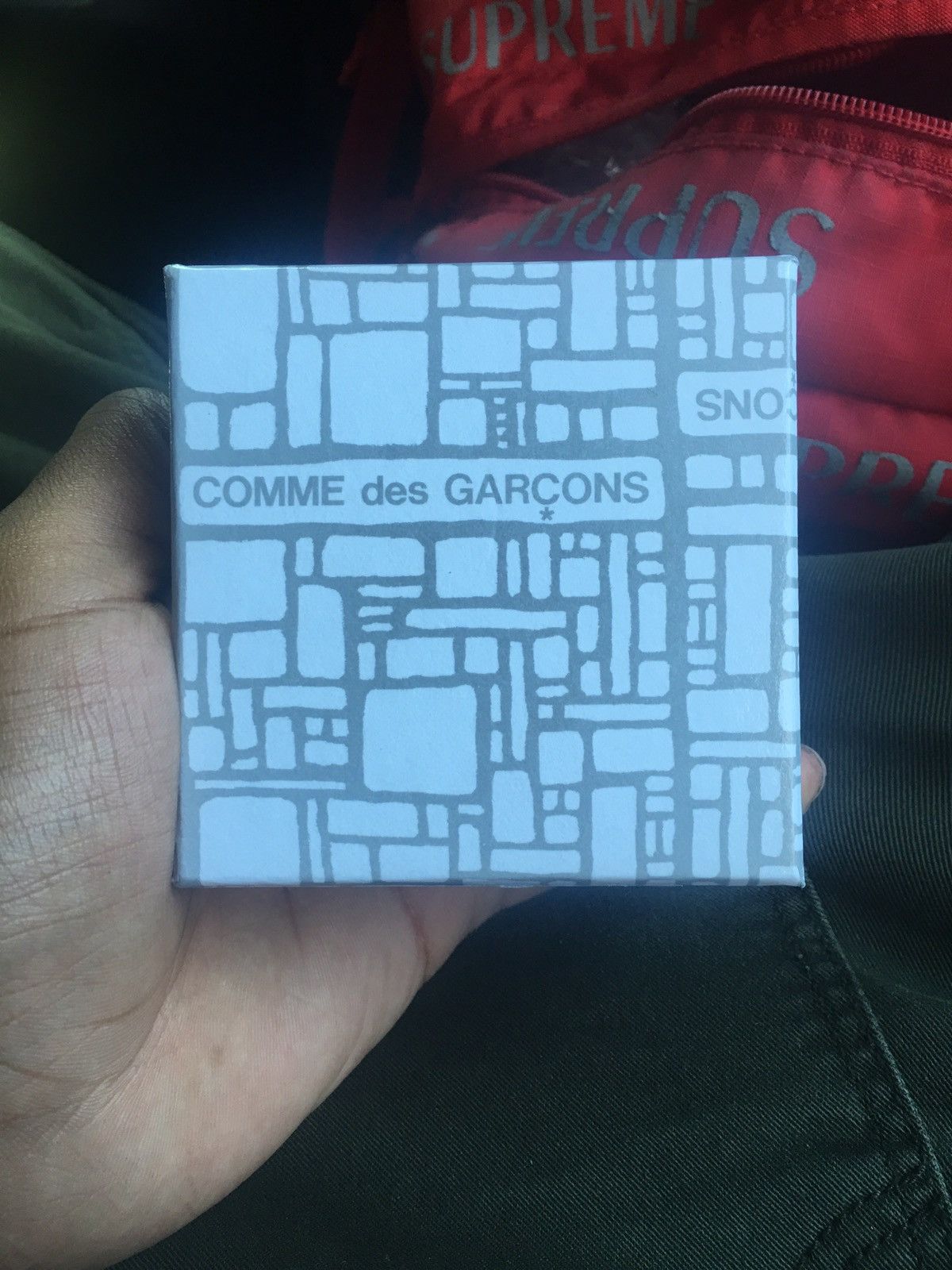 Cdg x supreme wallet best sale