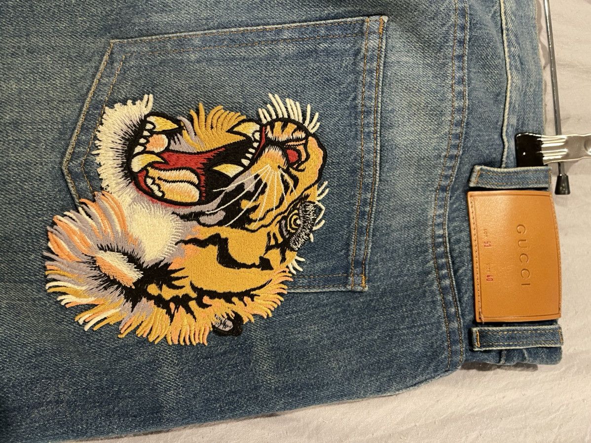 Gucci jeans tiger deals