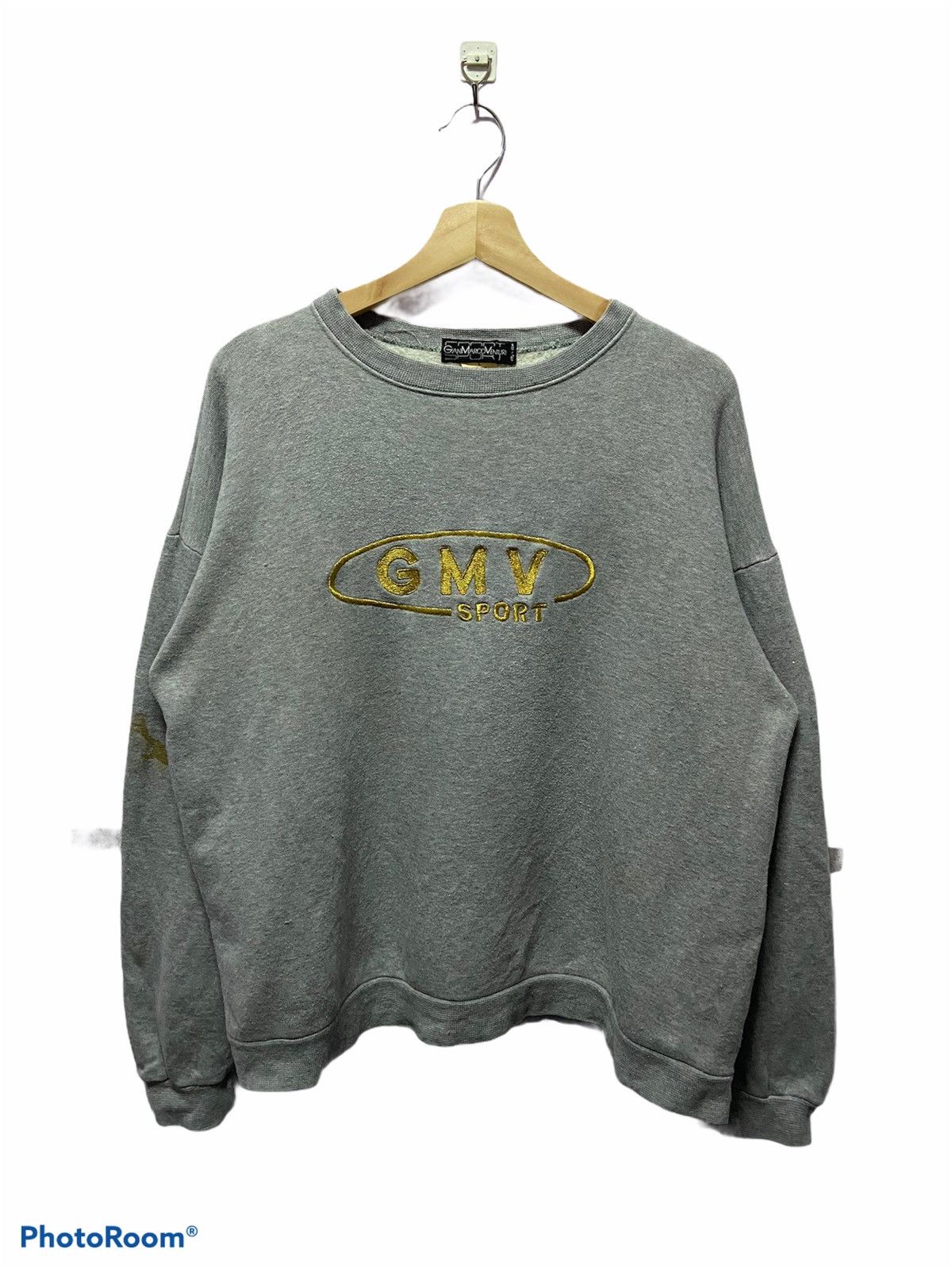 Gian Marco shops Venturi monogram sweater