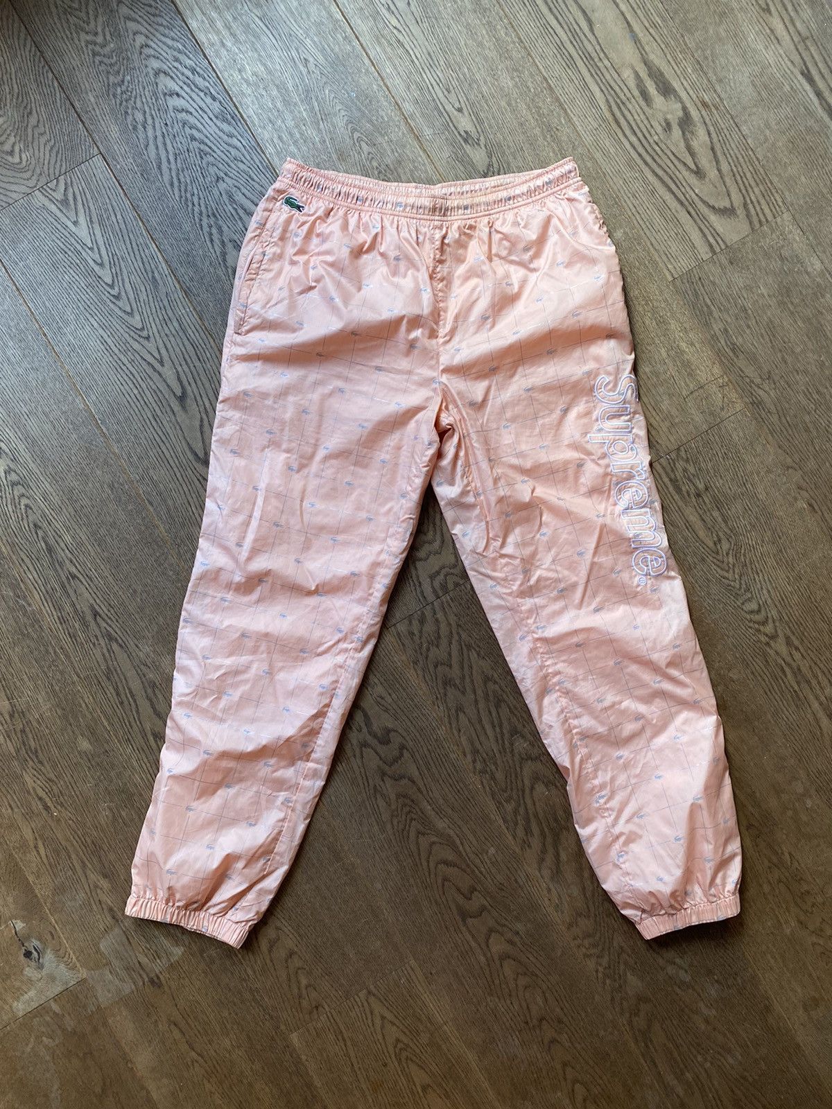 Supreme Supreme Lacoste Reflective Grid Nylon Track Pant Peach M | Grailed