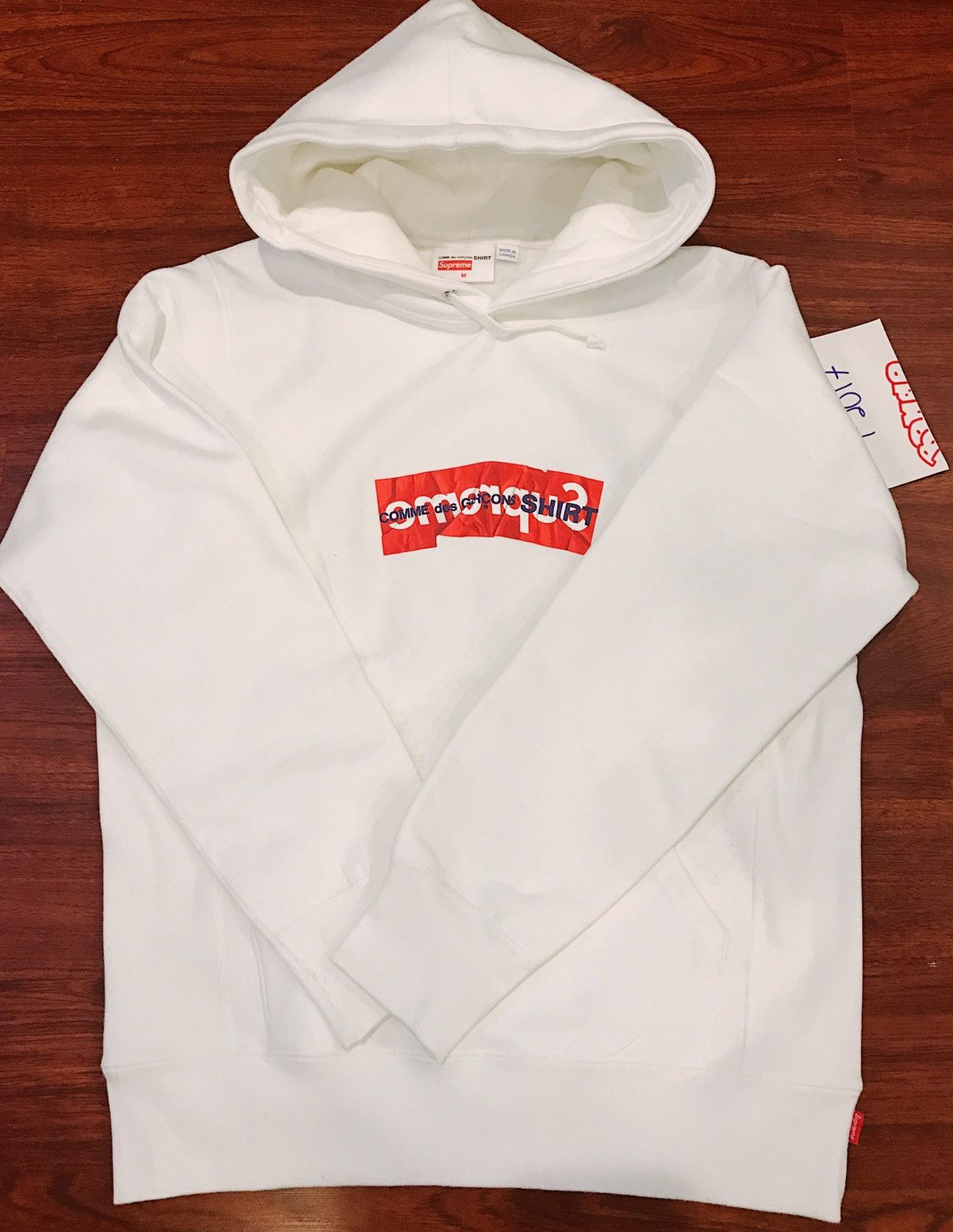 Supreme cdg best sale white hoodie