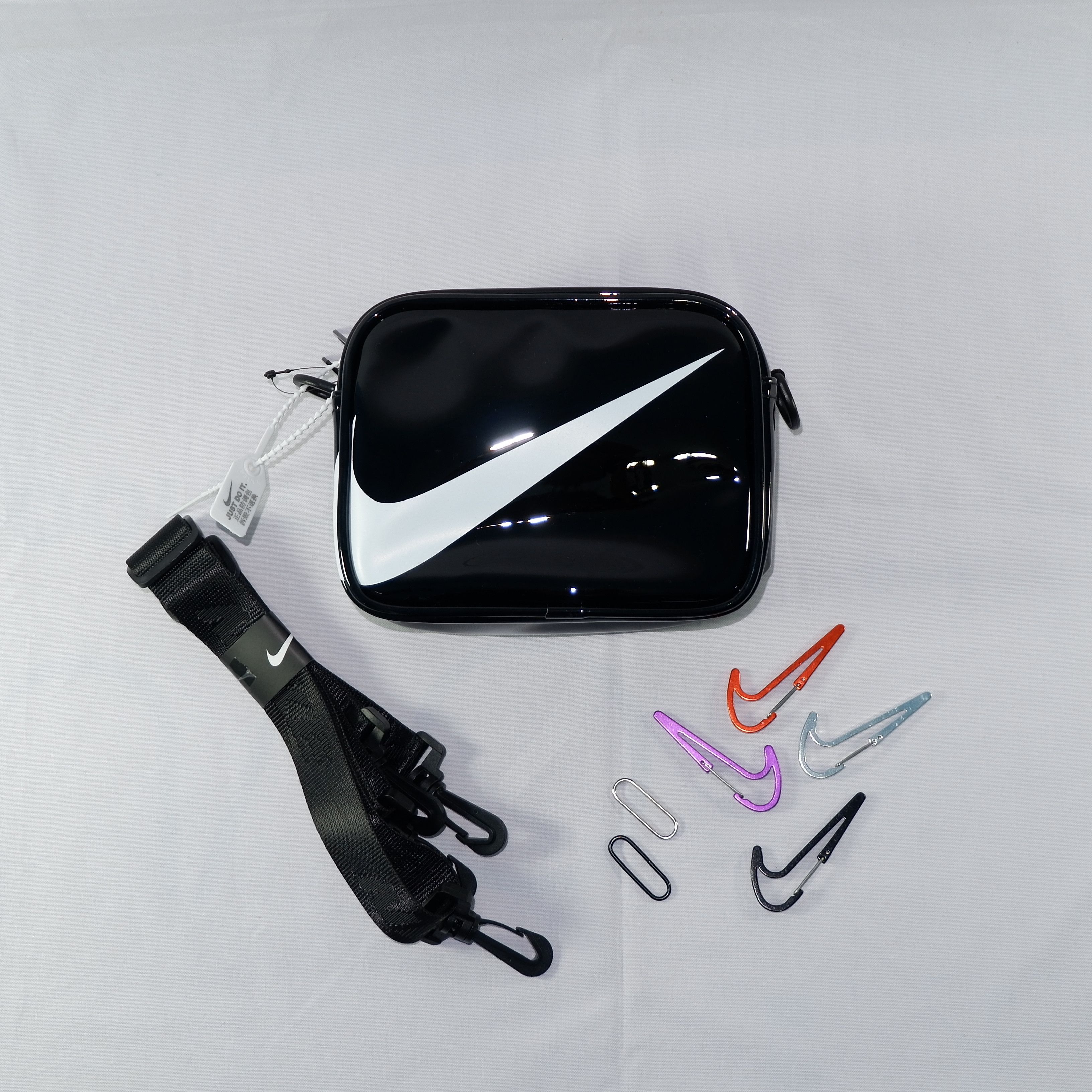 Nike NIKE MINI SWOOSH PVC SLING BAG BLACK RARE Grailed