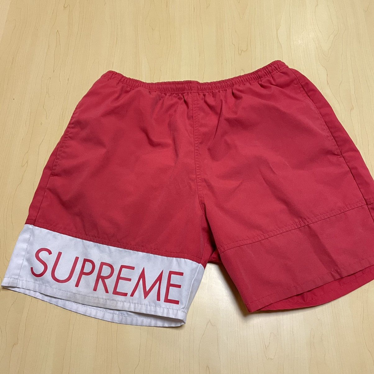 Supreme Supreme banner water shorts 2016 red nylon | Grailed