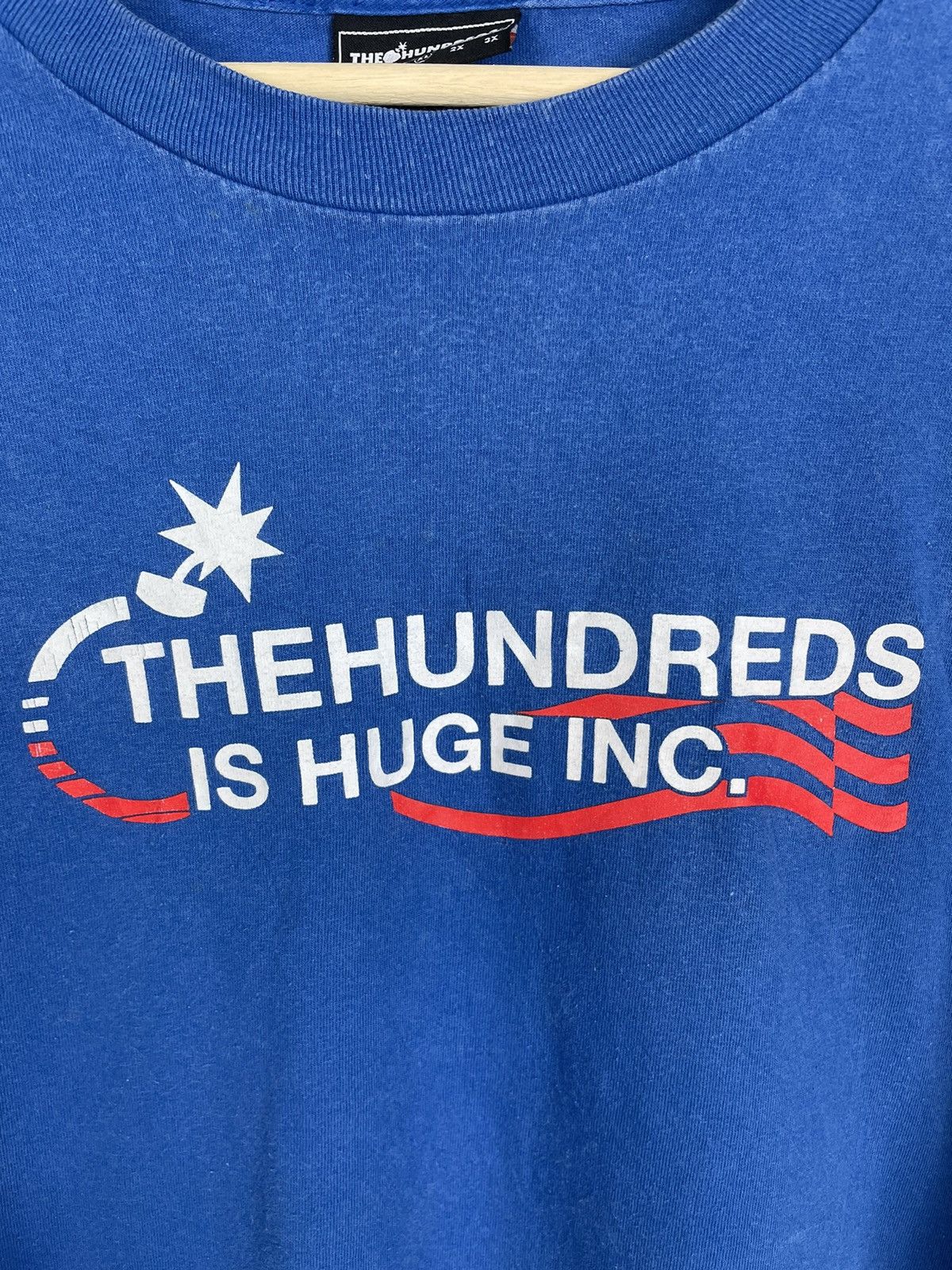 The Hundreds The Hundreds “Is Huge Inc.” Tee XL | Adam Bomb USA Size US XL / EU 56 / 4 - 5 Thumbnail