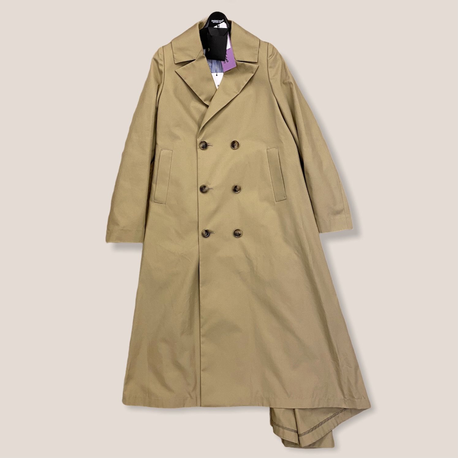 sue undercover asymmetric-hem Trench Coat