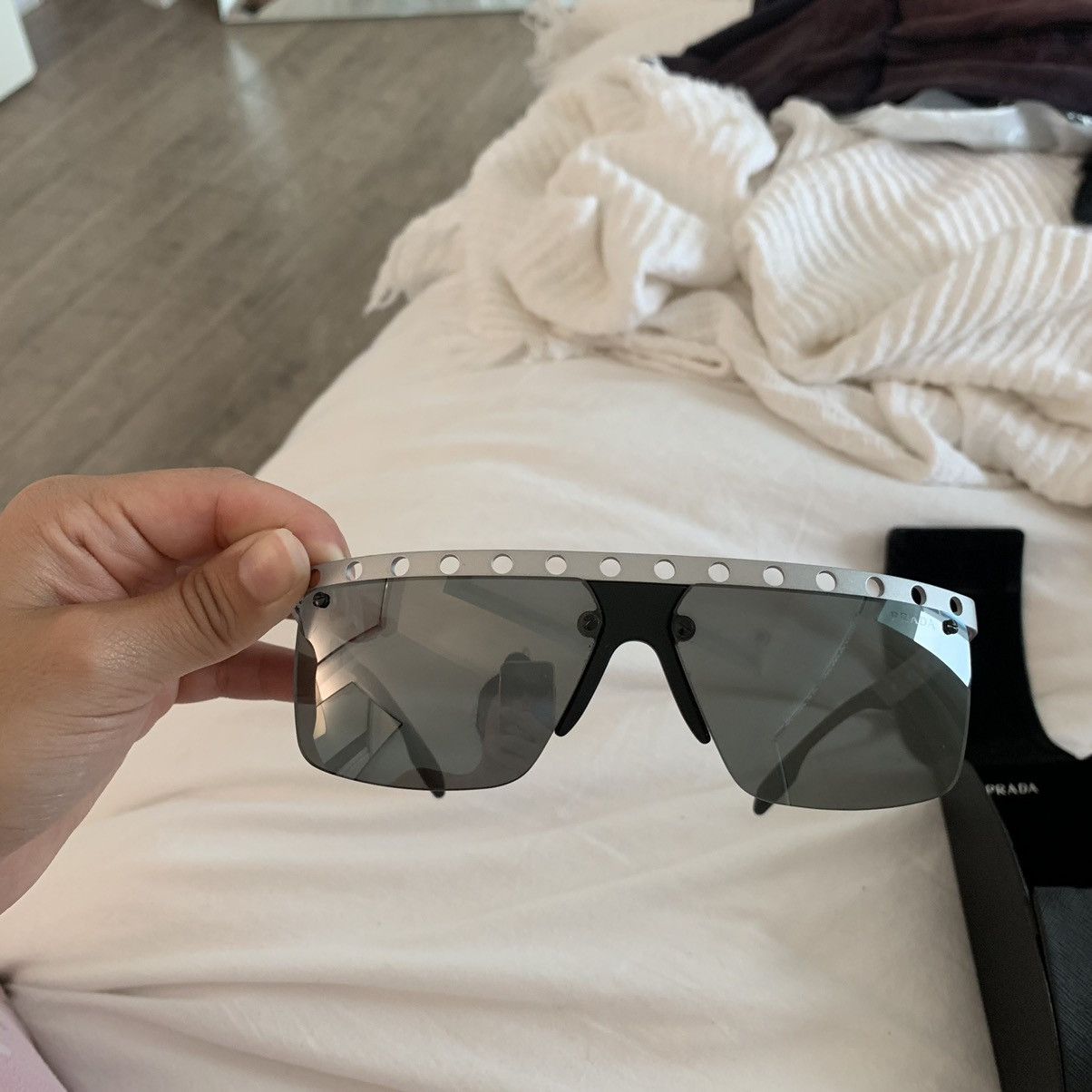Prada Prada machine perforated sunglasses | Grailed