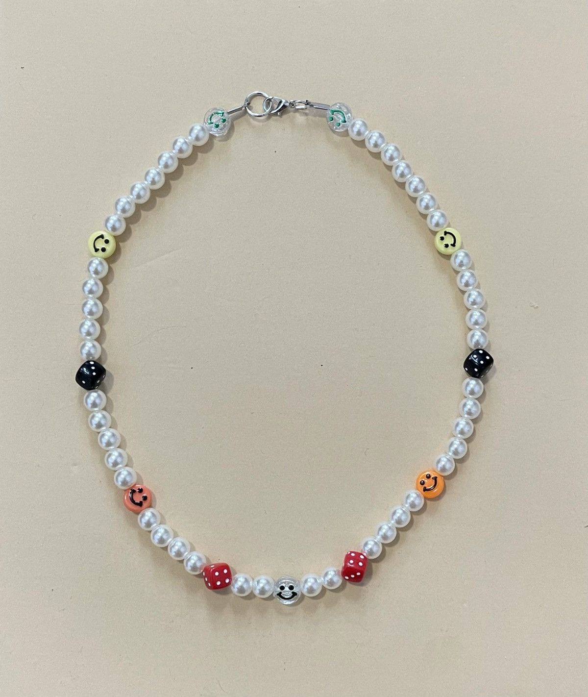 Smiley face pearl necklace