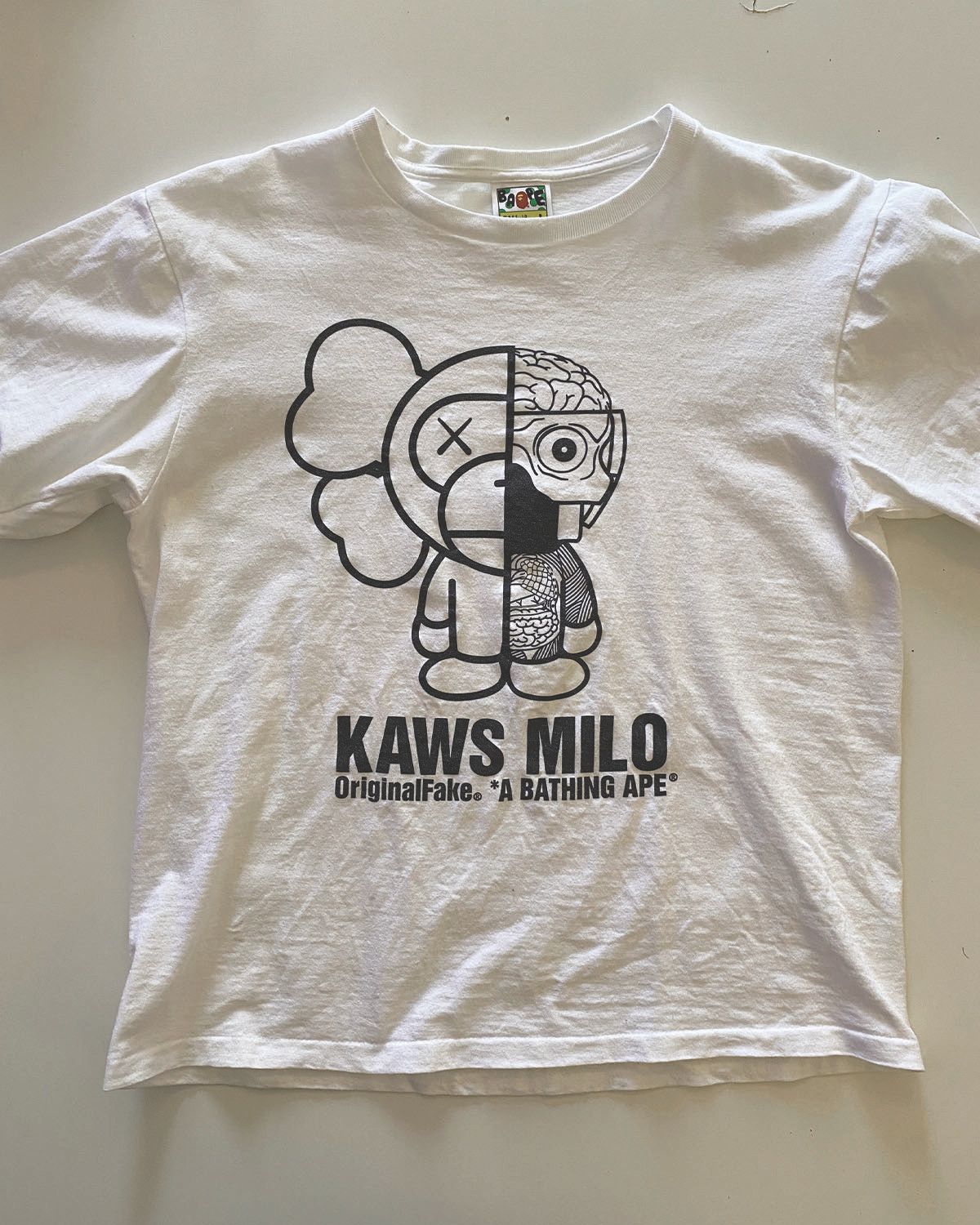 Bape Original Fake Baby Milo Kaws Tee | Grailed