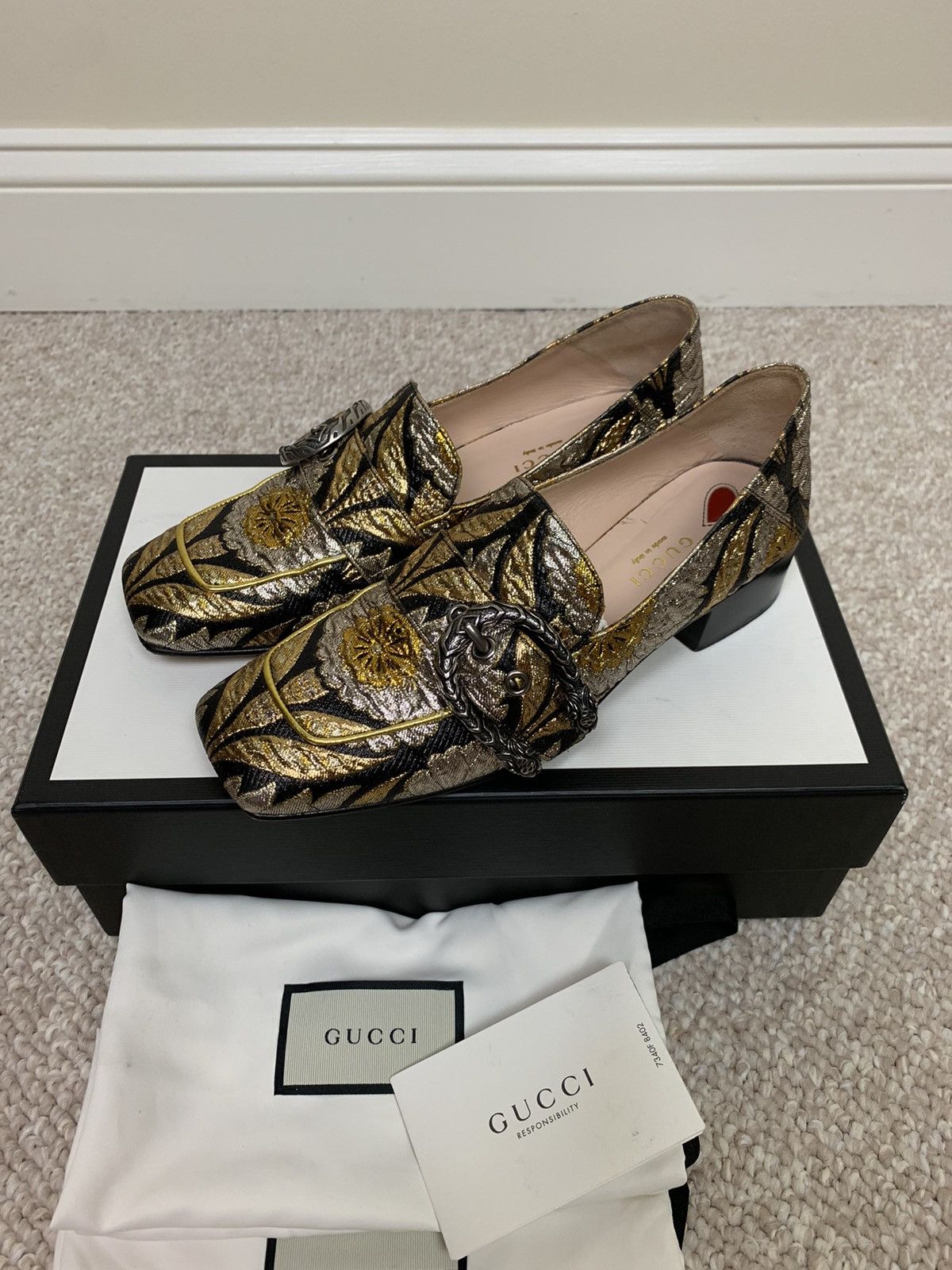 Gucci gold tiger buckle loafers