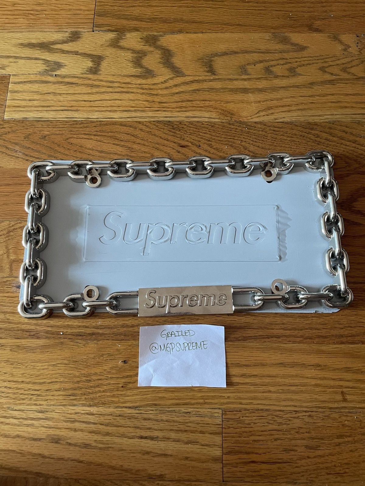 Supreme chain license hot sale plate frame gold