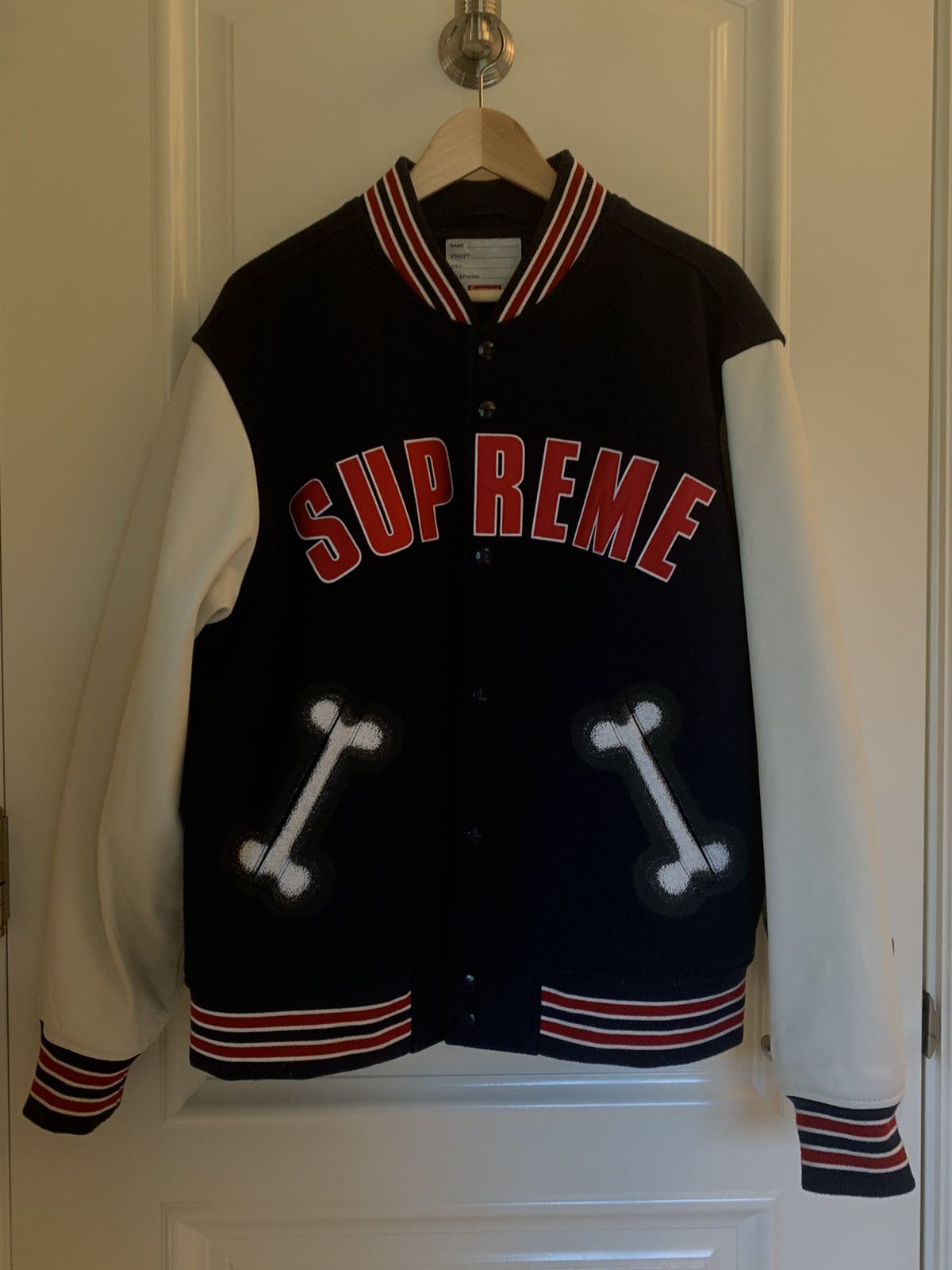 Supreme Supreme bone varsity jacket | Grailed