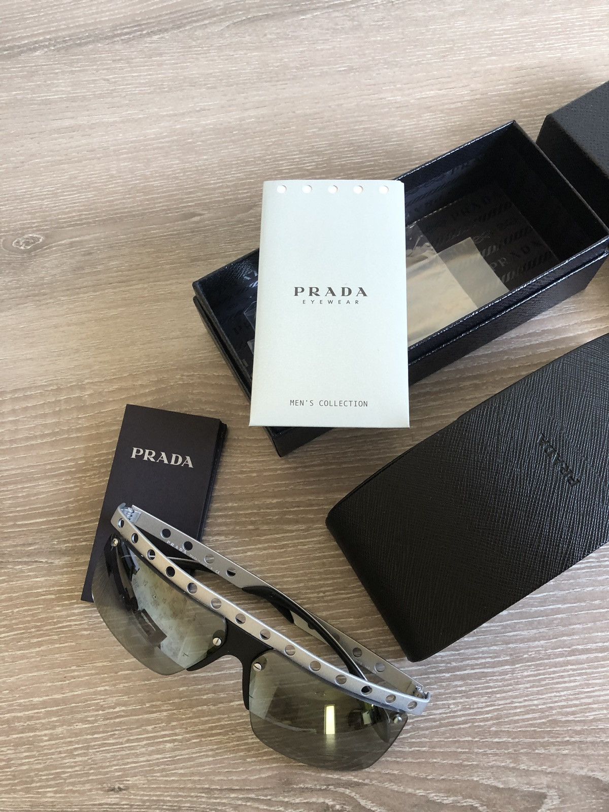 Prada Prada Machine sunglasses - flattop | Grailed