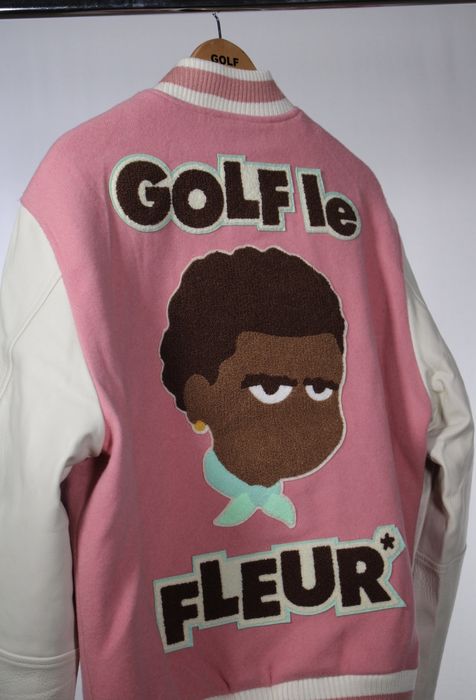 Who else agrees that this is a picture of tyler the creator smiling in a  brown hat and green golf le fleur varsity jacket : r/tylerthecreator