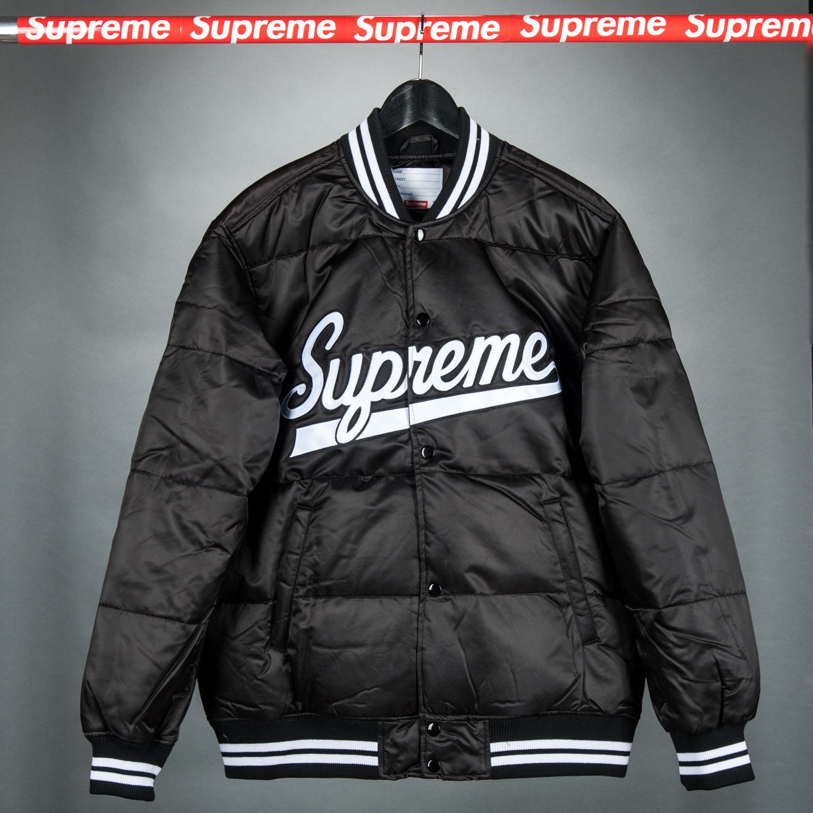Supreme script varsity puffy jacket deals