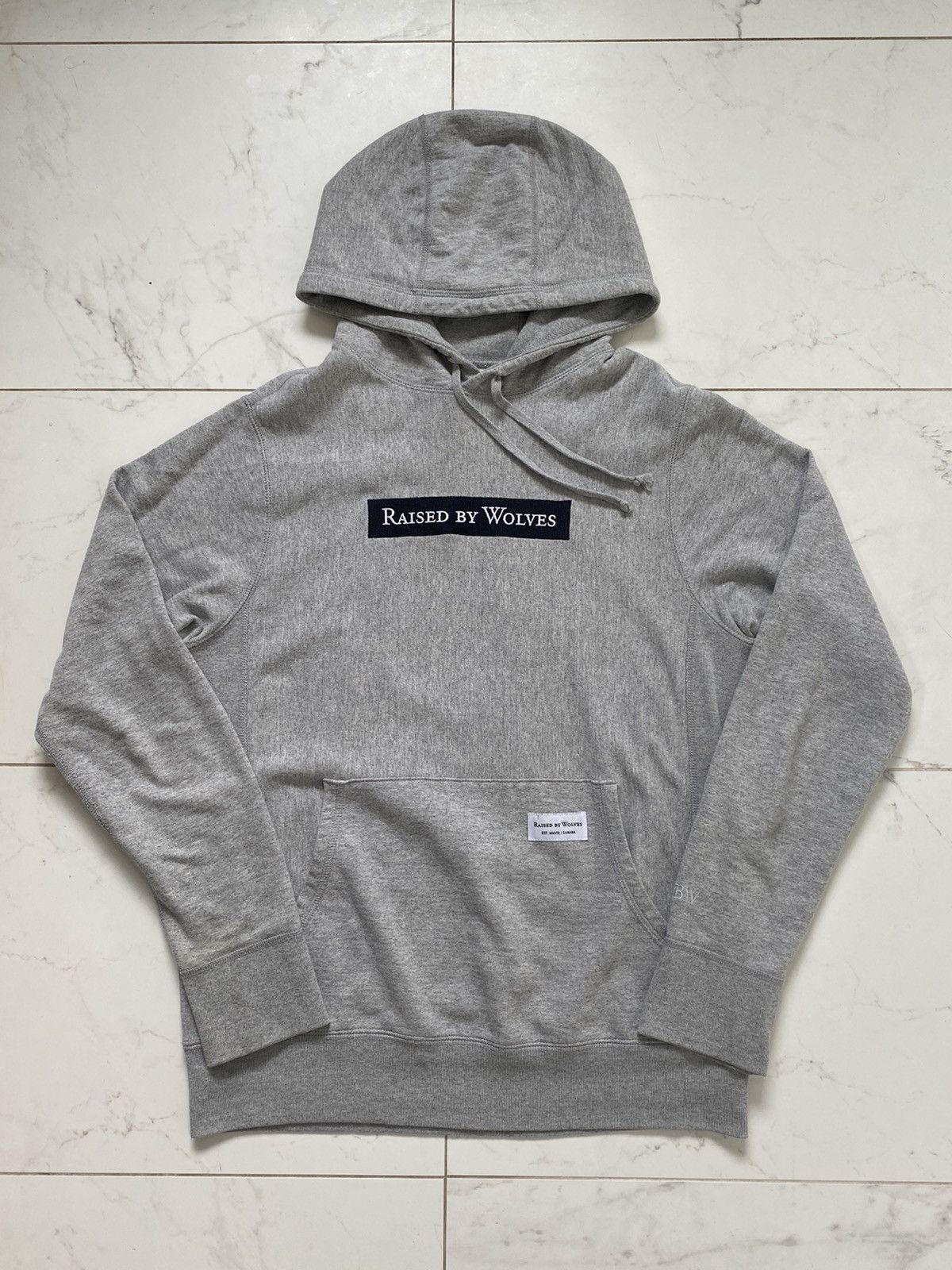 Raised by wolves box logo hoodie hotsell