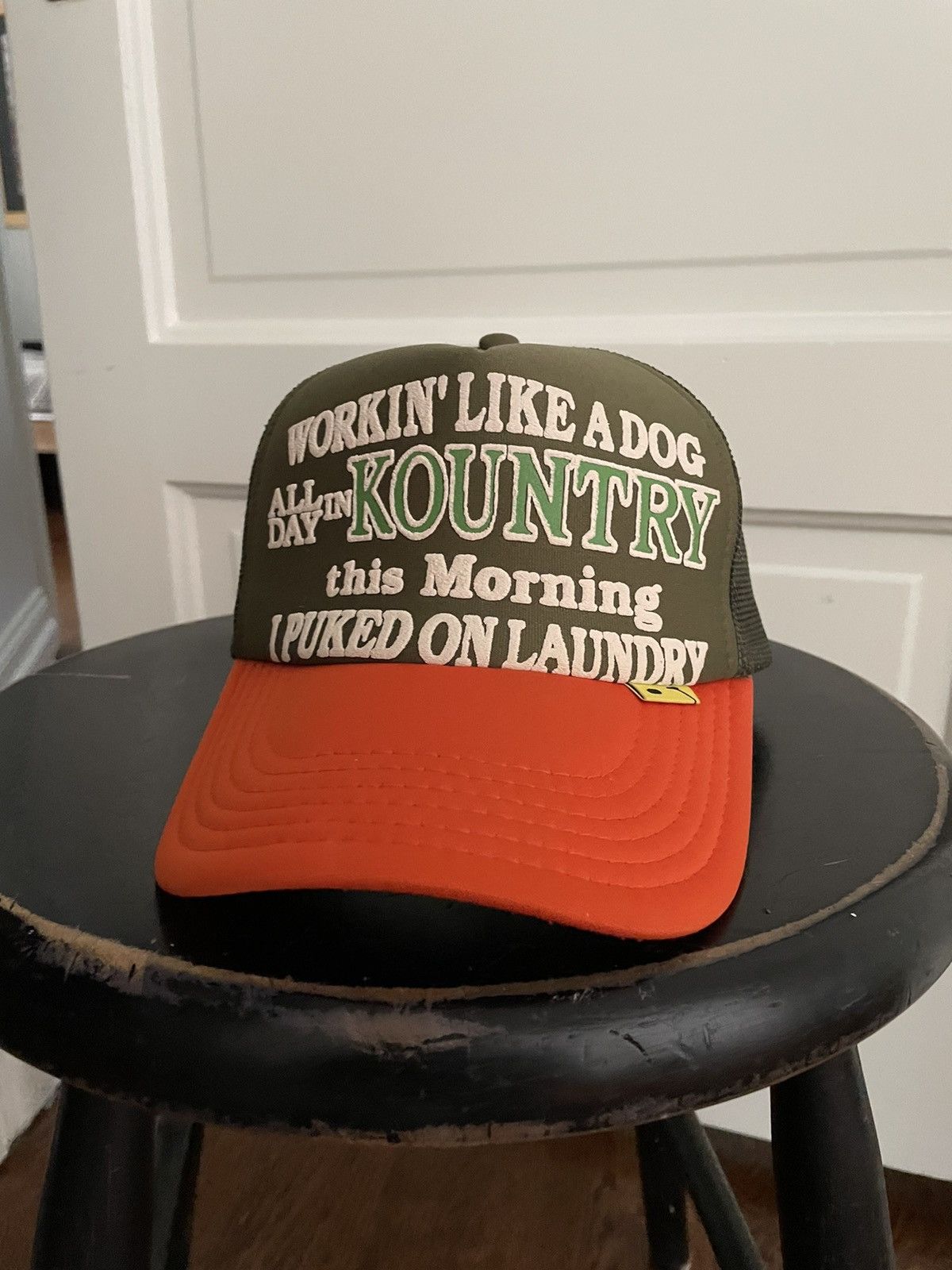 Puked On Laundry Mesh Trucker Hat Olive / Orange