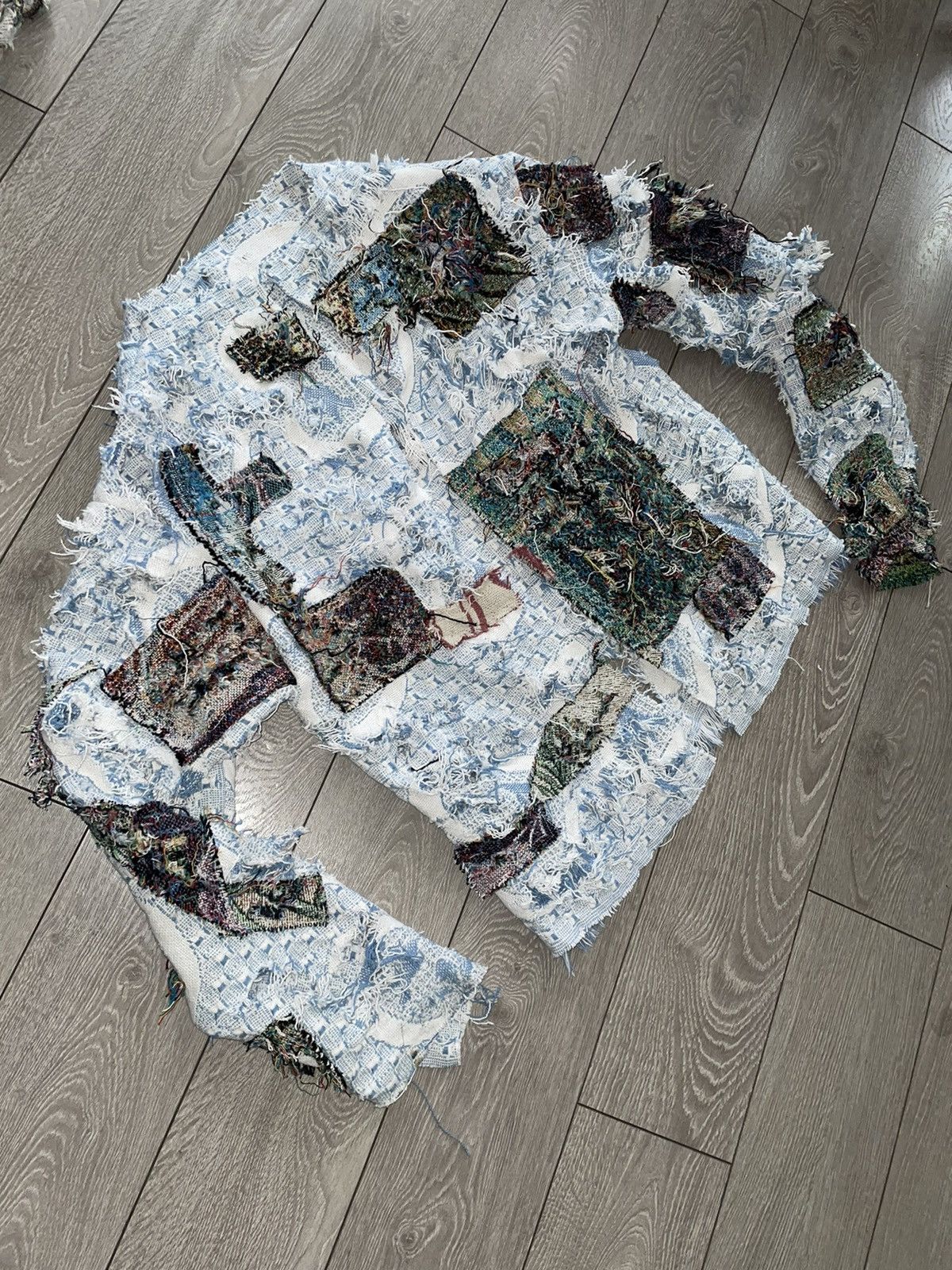 Distressed patchwork threaded woven sweater
