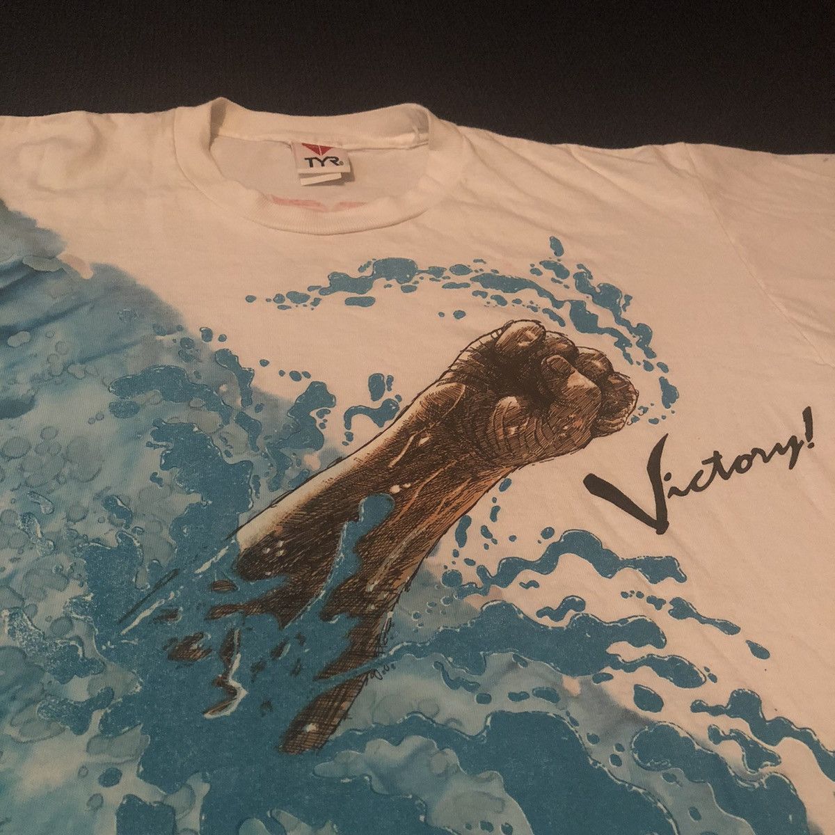Vintage Vintage 1990s TYR Sport Victory! Fist All Over Print AOP Tee Size US L / EU 52-54 / 3 - 4 Thumbnail